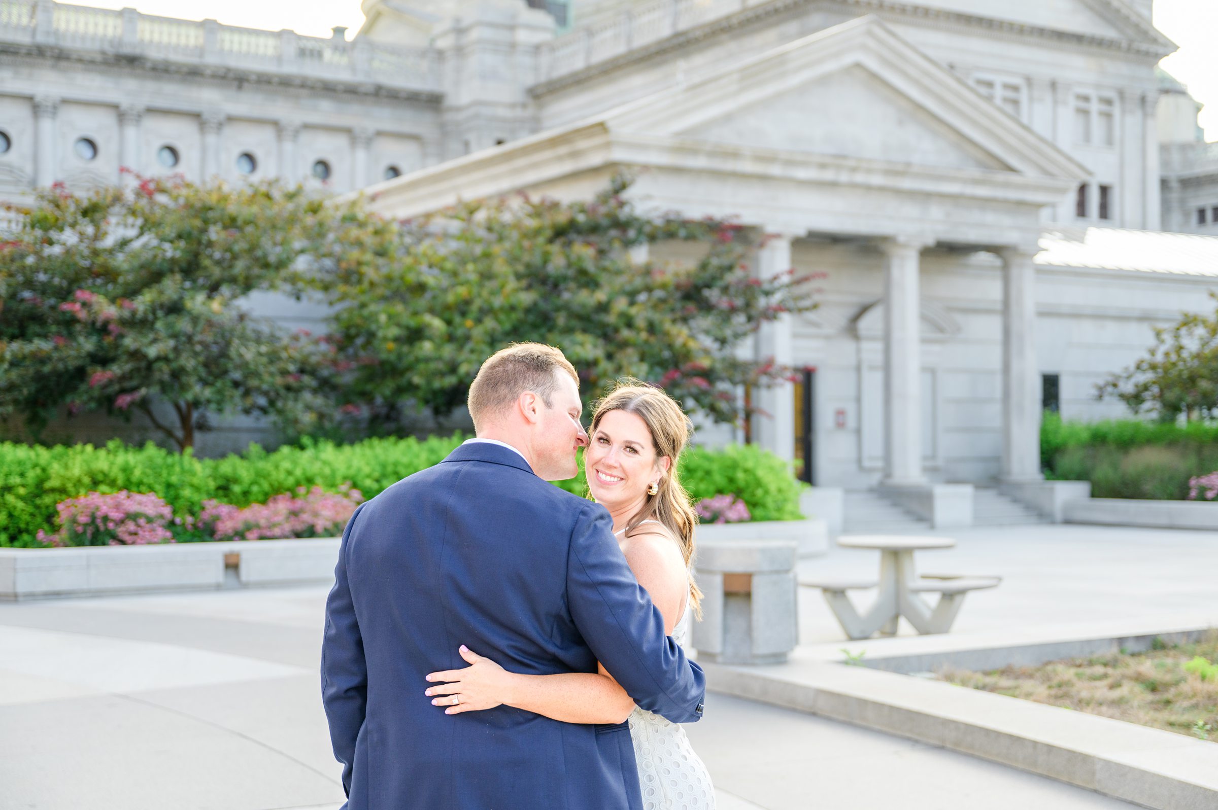 Engaged couple at the Pennsylvania State Capitol for their summer engagement session photographed by Baltimore Wedding Photographer Cait Kramer Photography.