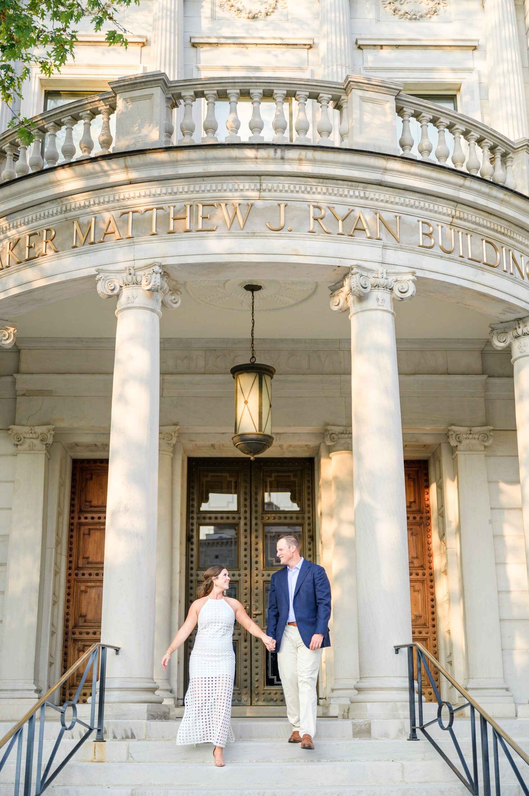 Engaged couple at the Pennsylvania State Capitol for their summer engagement session photographed by Baltimore Wedding Photographer Cait Kramer Photography.