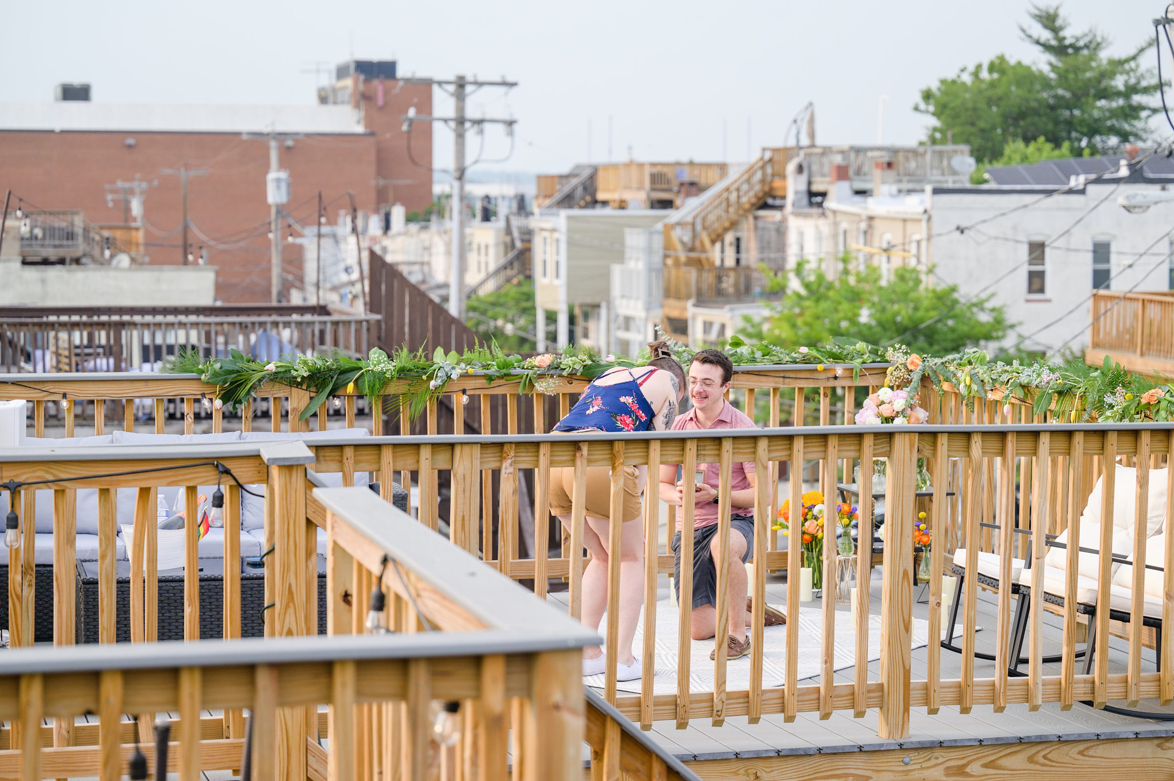 Sarah and Brenton's surprise proposal at their apartment rooftop in Baltimore, Maryland photographed by Baltimore Wedding Photographer Cait Kramer.