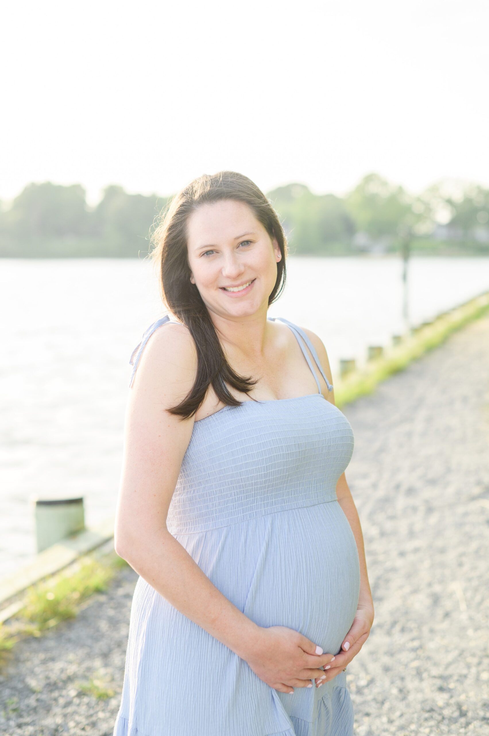 Waterfront maternity portrait session photographed by Baltimore Maternity and Newborn Photographer Cait Kramer.