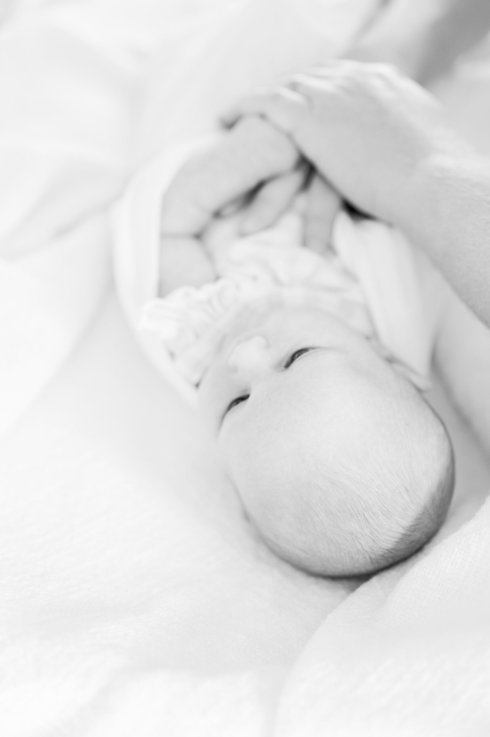 In home lifestyle newborn session photographed by Baltimore Maternity and Newborn Photographer Cait Kramer.