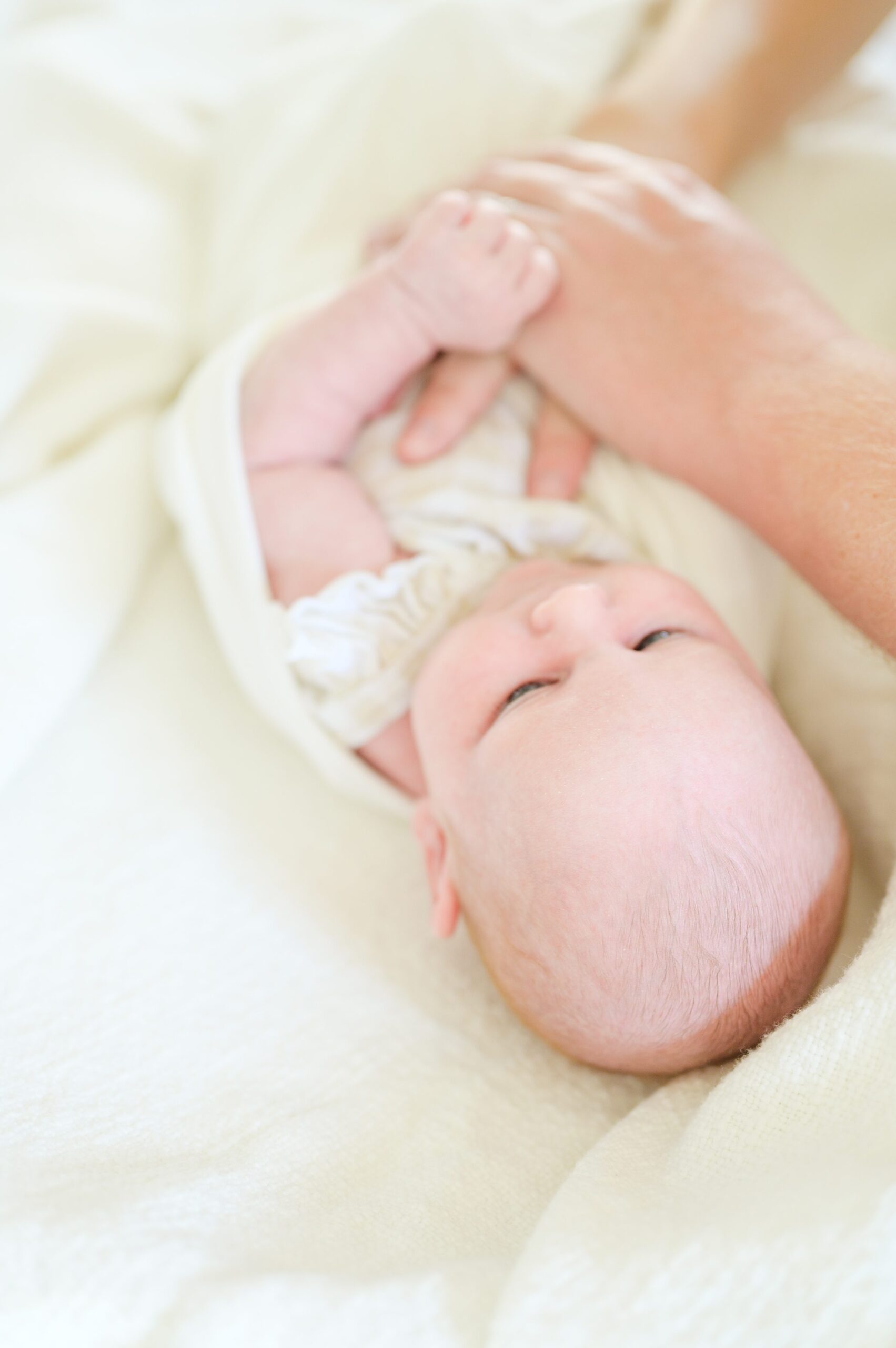 In home lifestyle newborn session photographed by Baltimore Maternity and Newborn Photographer Cait Kramer.