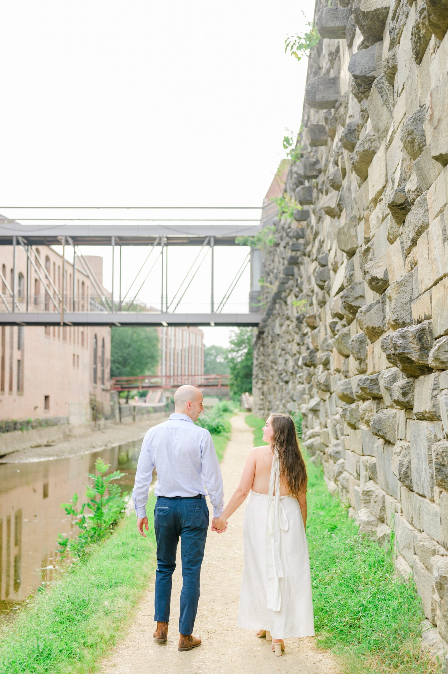 Engaged coupled at the Georgetown Canal for their summer engagement session photographed by Baltimore Wedding Photographer Cait Kramer.