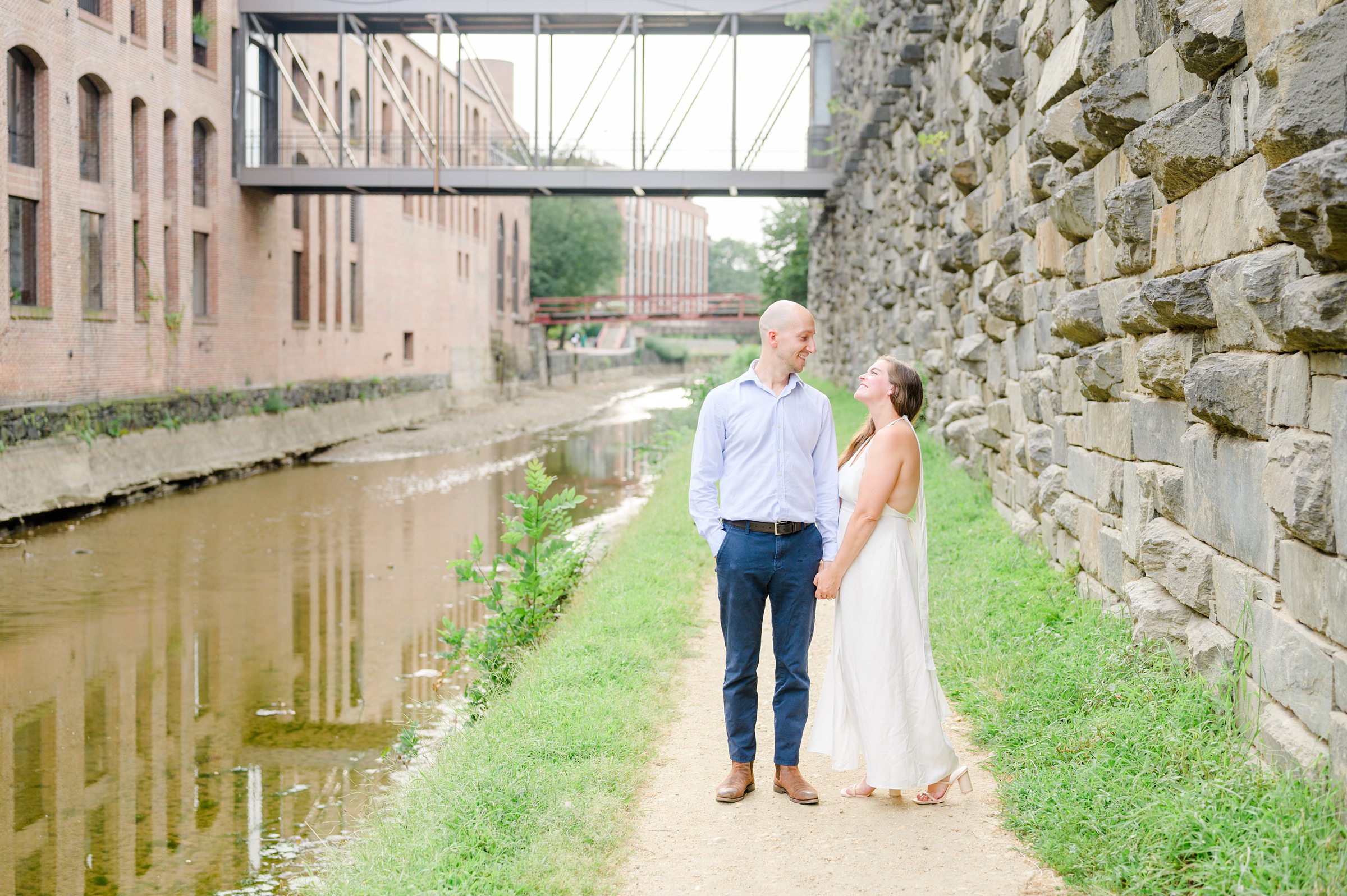 Engaged coupled at the Georgetown Canal for their summer engagement session photographed by Baltimore Wedding Photographer Cait Kramer.