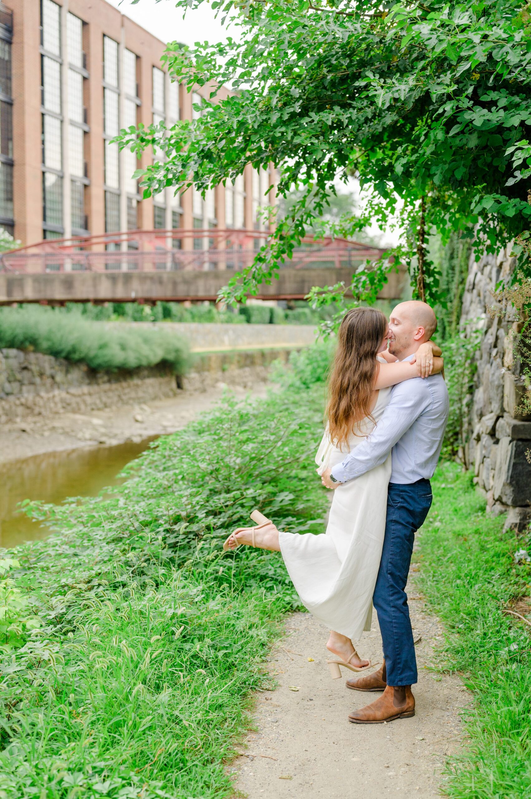 Engaged coupled at the Georgetown Canal for their summer engagement session photographed by Baltimore Wedding Photographer Cait Kramer.