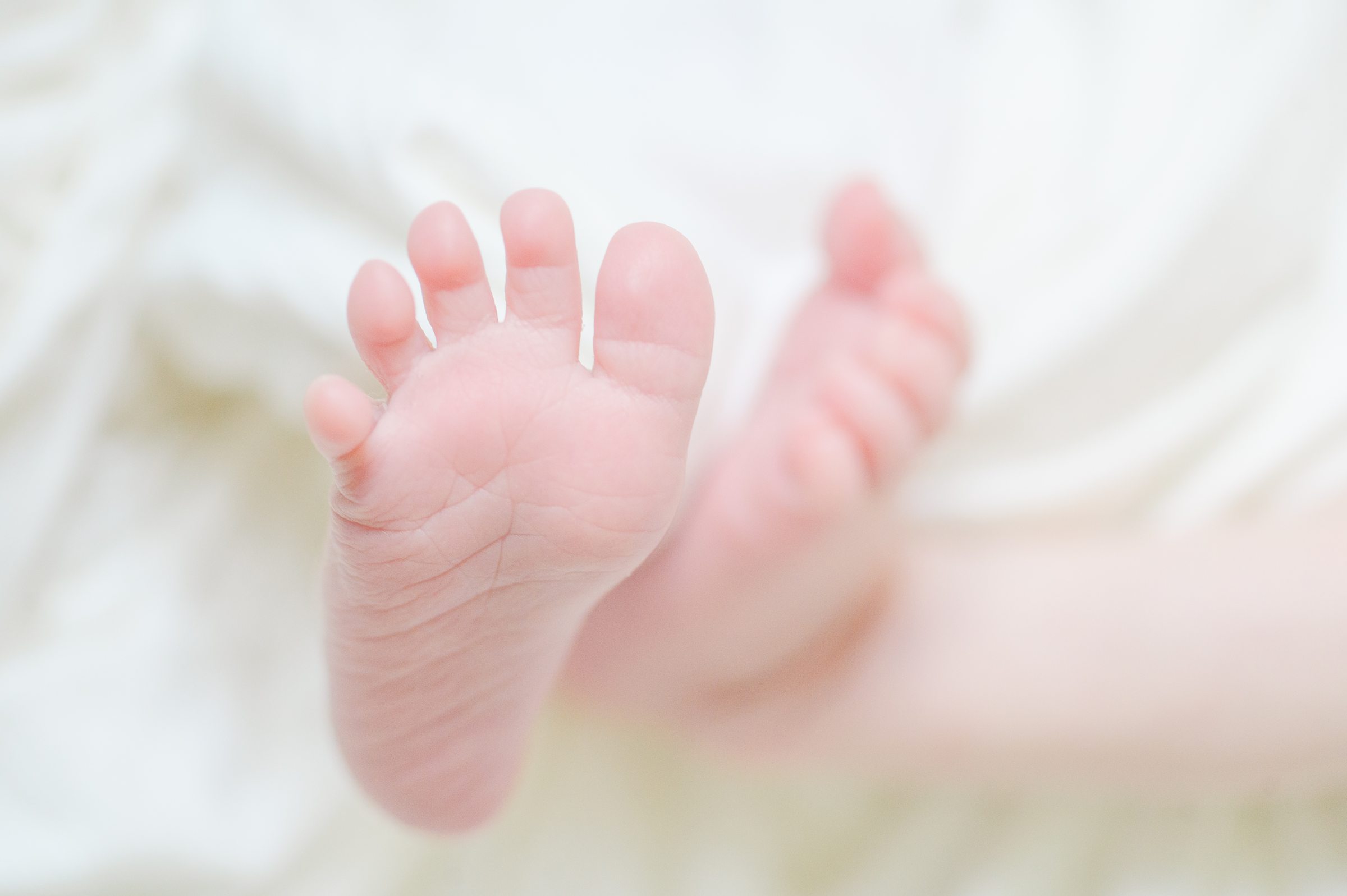 In home newborn session in Washington, DC photographed by Baltimore lifestyle newborn photographer Cait Kramer.