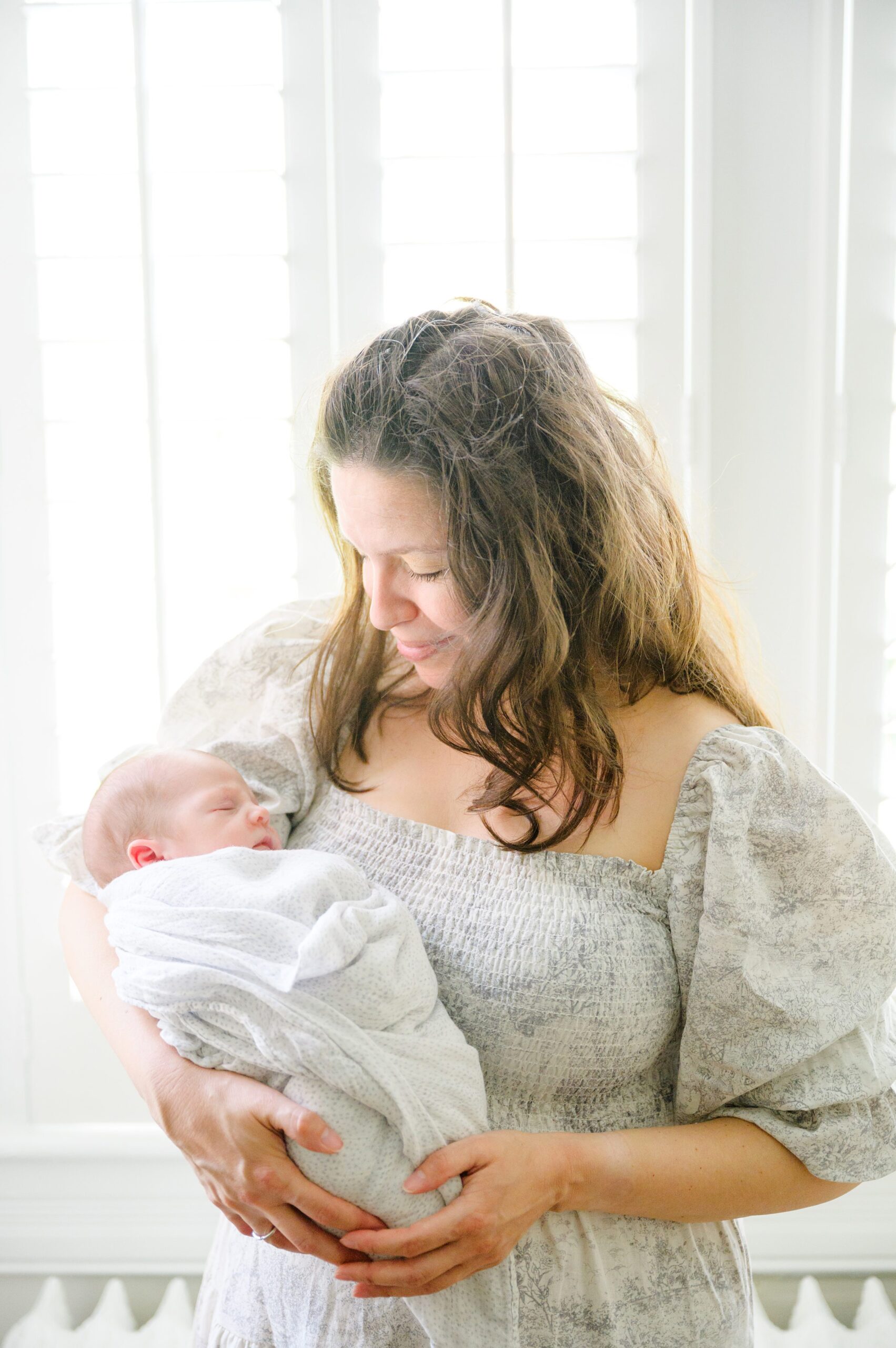 In home newborn session in Washington, DC photographed by Baltimore lifestyle newborn photographer Cait Kramer.