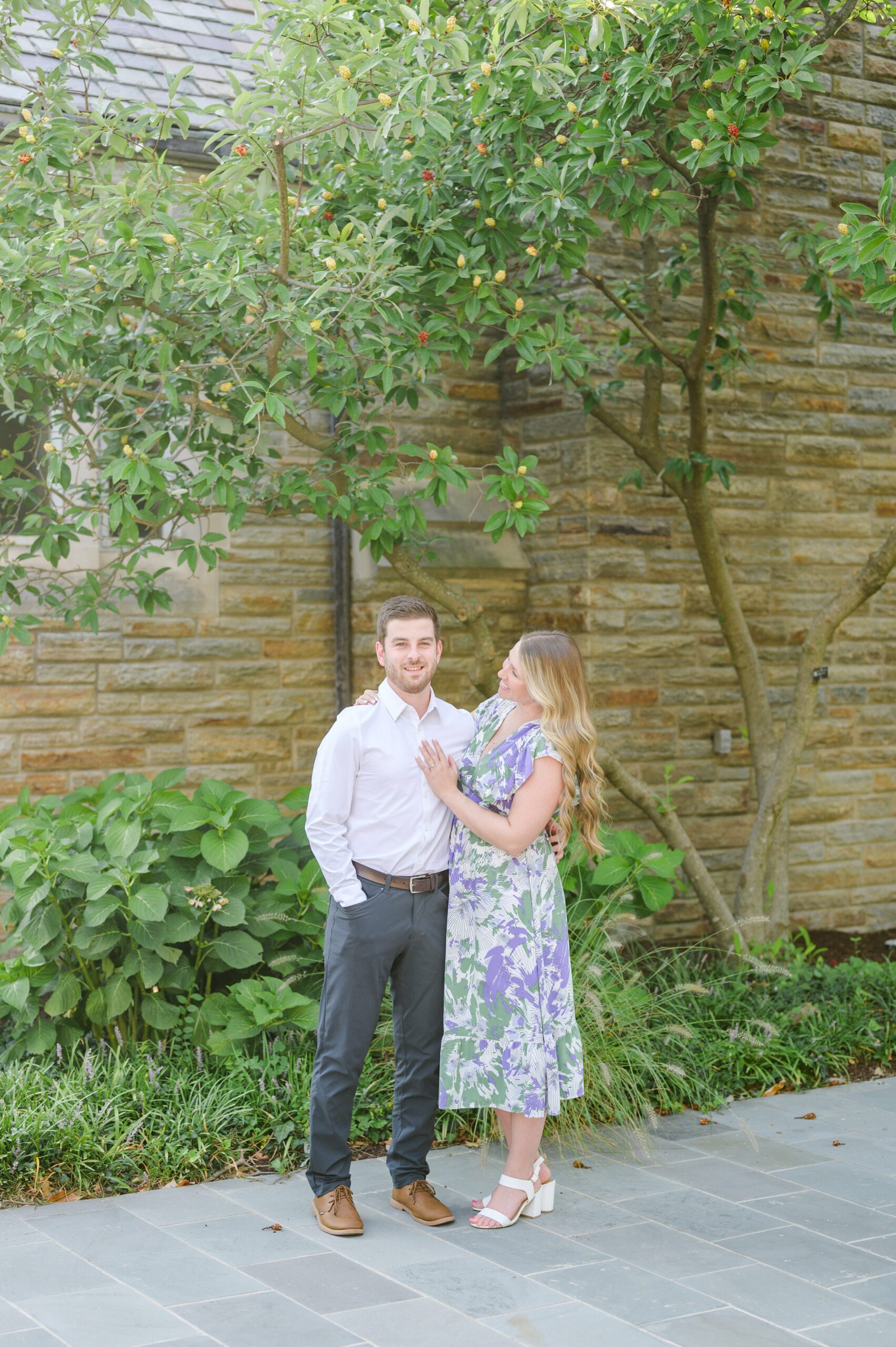 Engaged couple at the Loyola University Maryland campus for their summer engagement session in Baltimore, MD photographed by Baltimore Wedding Photographer Cait Kramer Photography