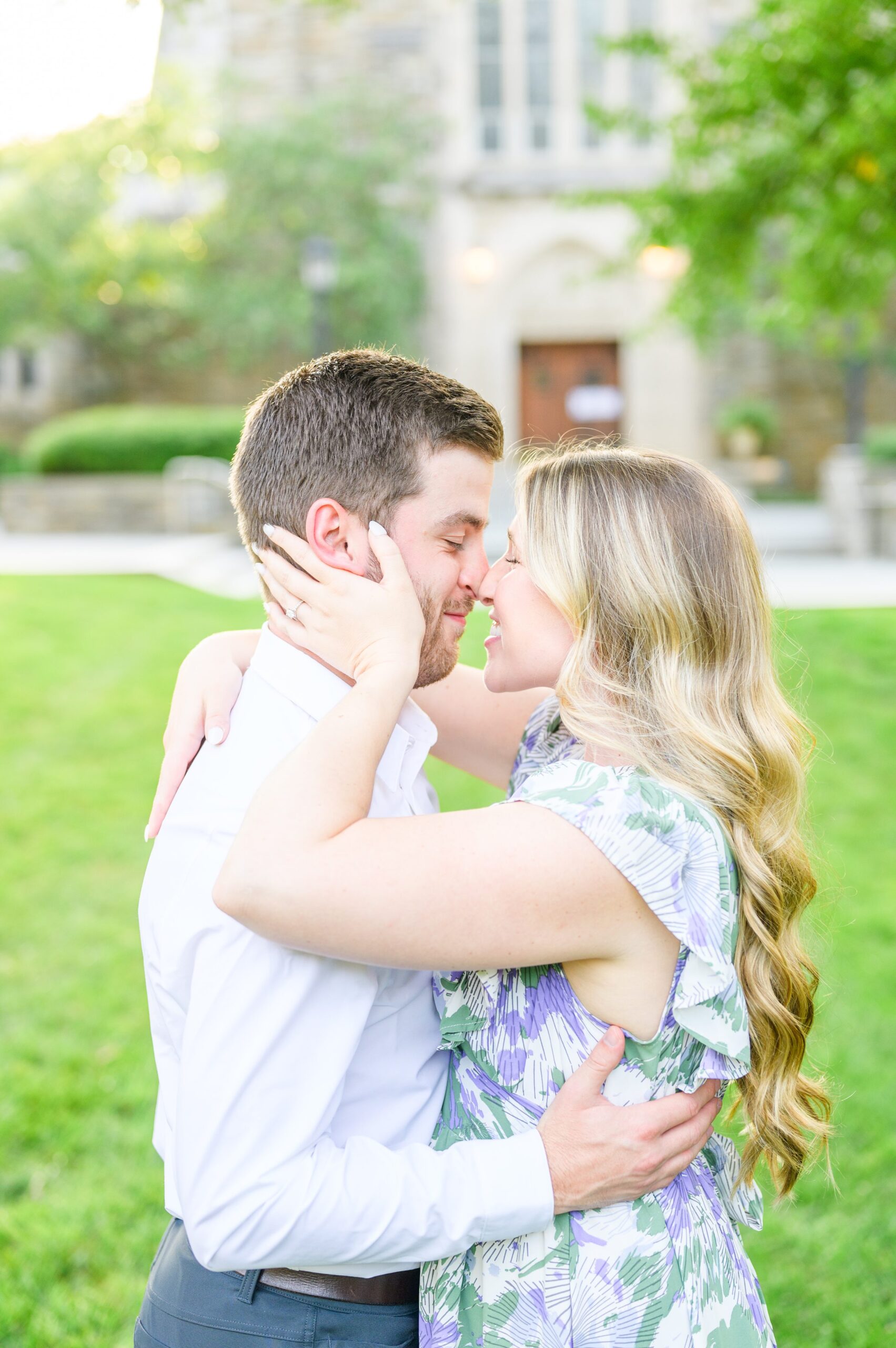 Engaged couple at the Loyola University Maryland campus for their summer engagement session in Baltimore, MD photographed by Baltimore Wedding Photographer Cait Kramer Photography