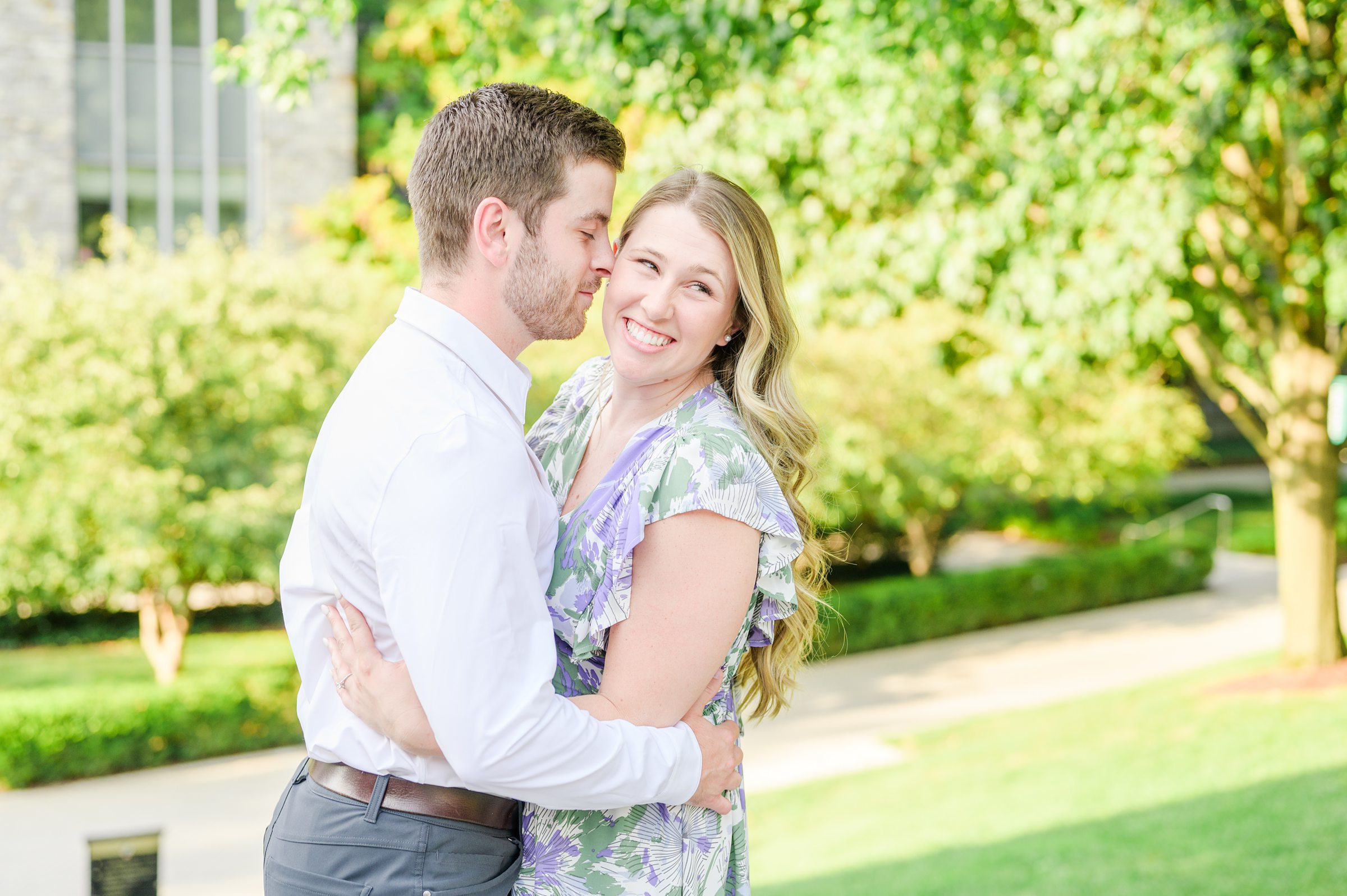 Engaged couple at the Loyola University Maryland campus for their summer engagement session in Baltimore, MD photographed by Baltimore Wedding Photographer Cait Kramer Photography