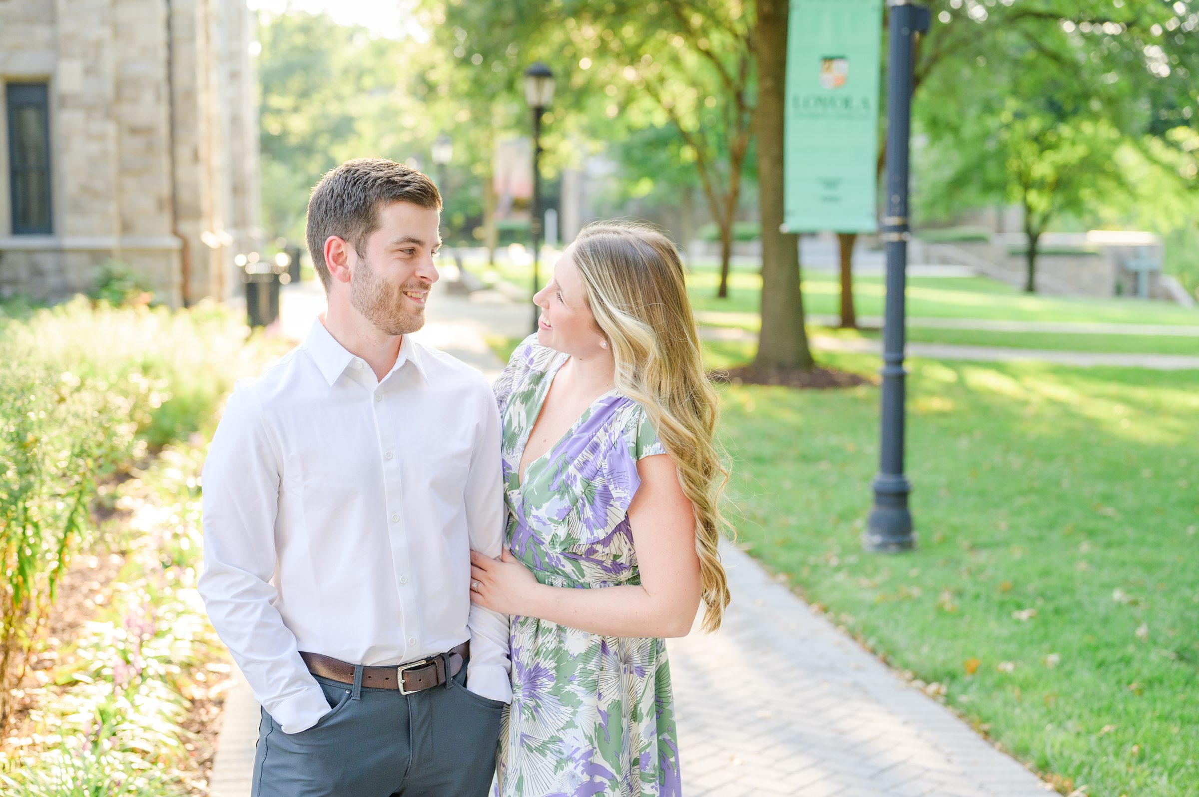 Engaged couple at the Loyola University Maryland campus for their summer engagement session in Baltimore, MD photographed by Baltimore Wedding Photographer Cait Kramer Photography