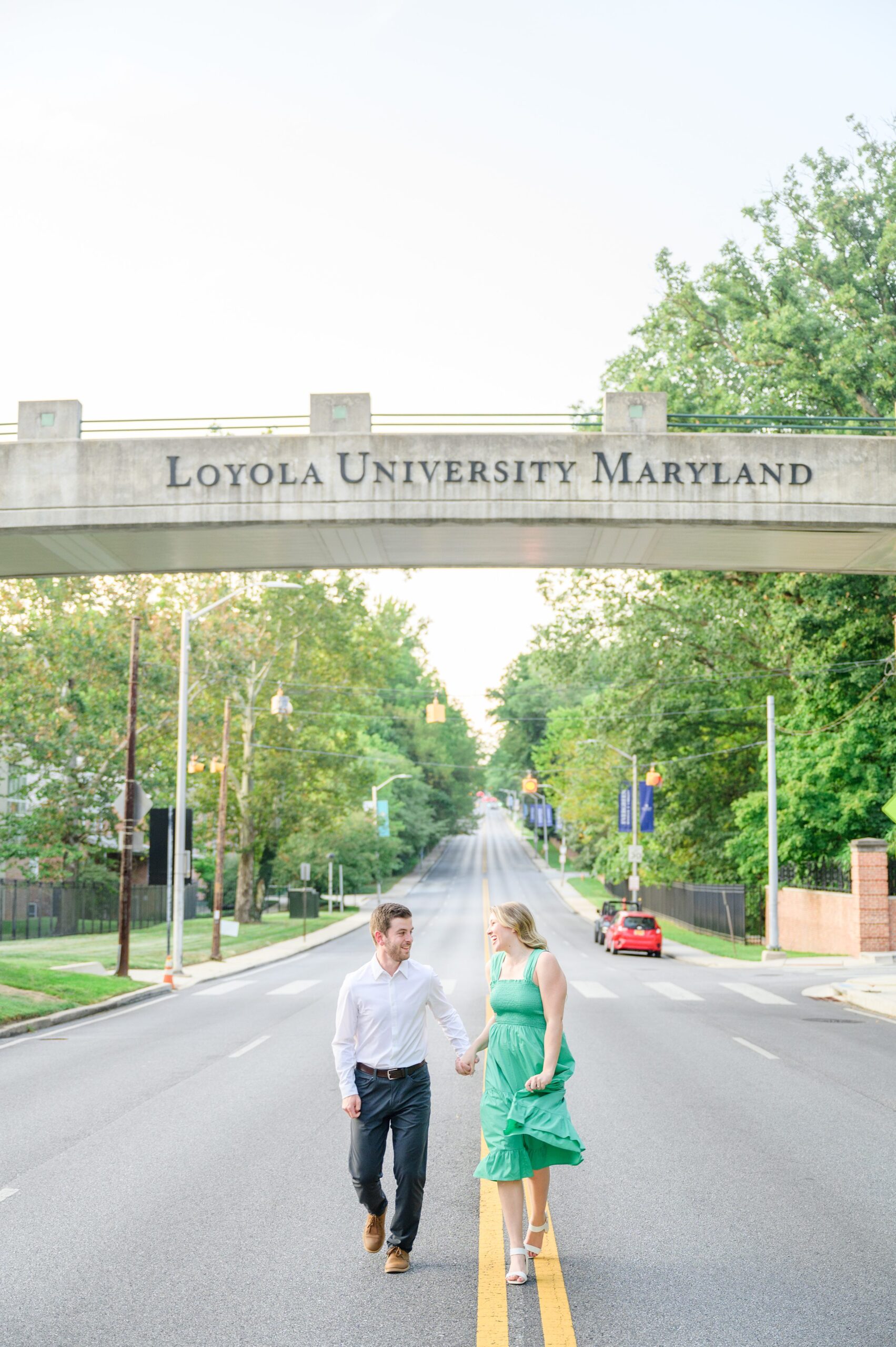 Engaged couple at the Loyola University Maryland campus for their summer engagement session in Baltimore, MD photographed by Baltimore Wedding Photographer Cait Kramer Photography