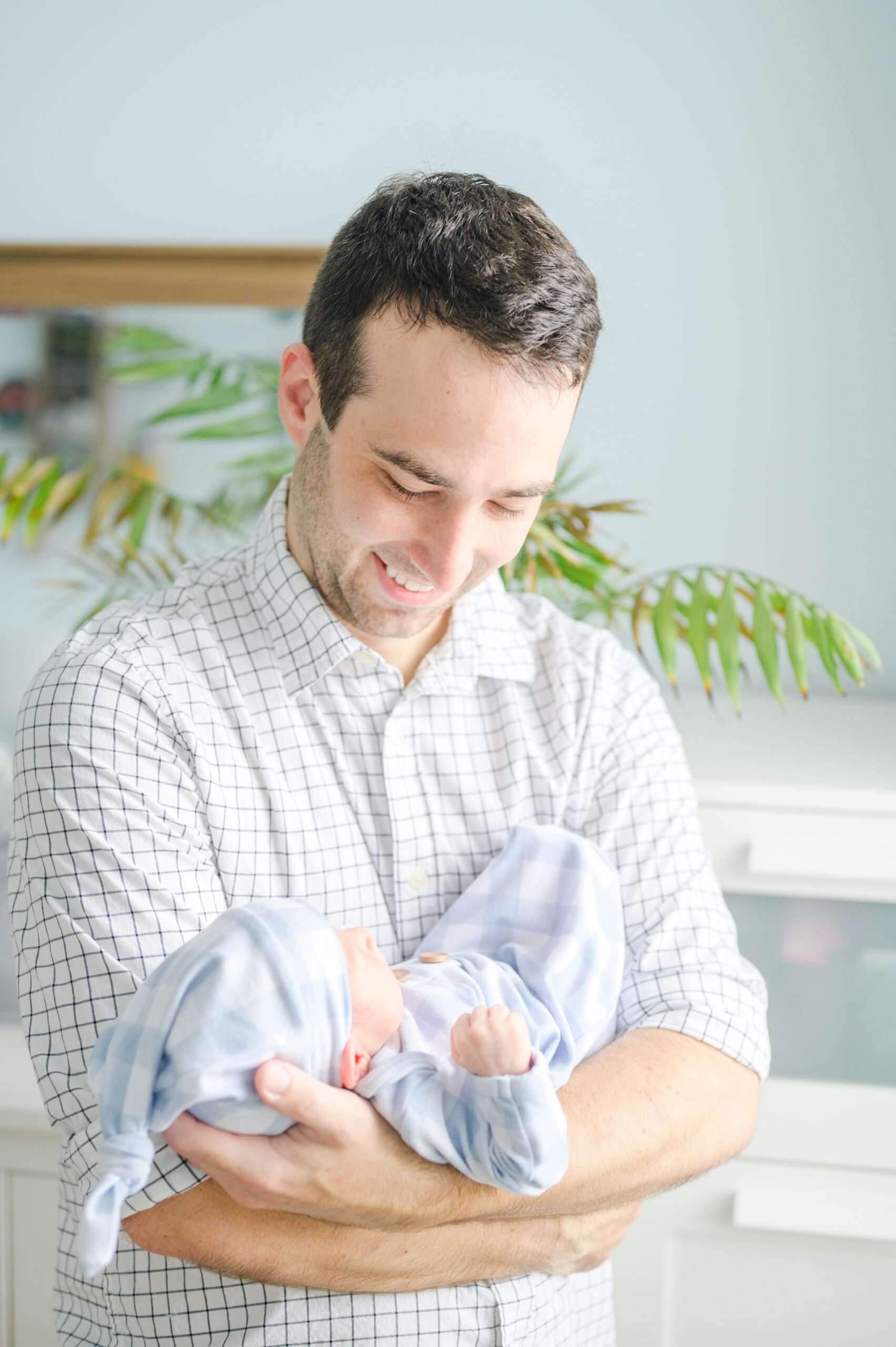 In-home Philly lifestyle newborn portrait session photographed by Cait Kramer