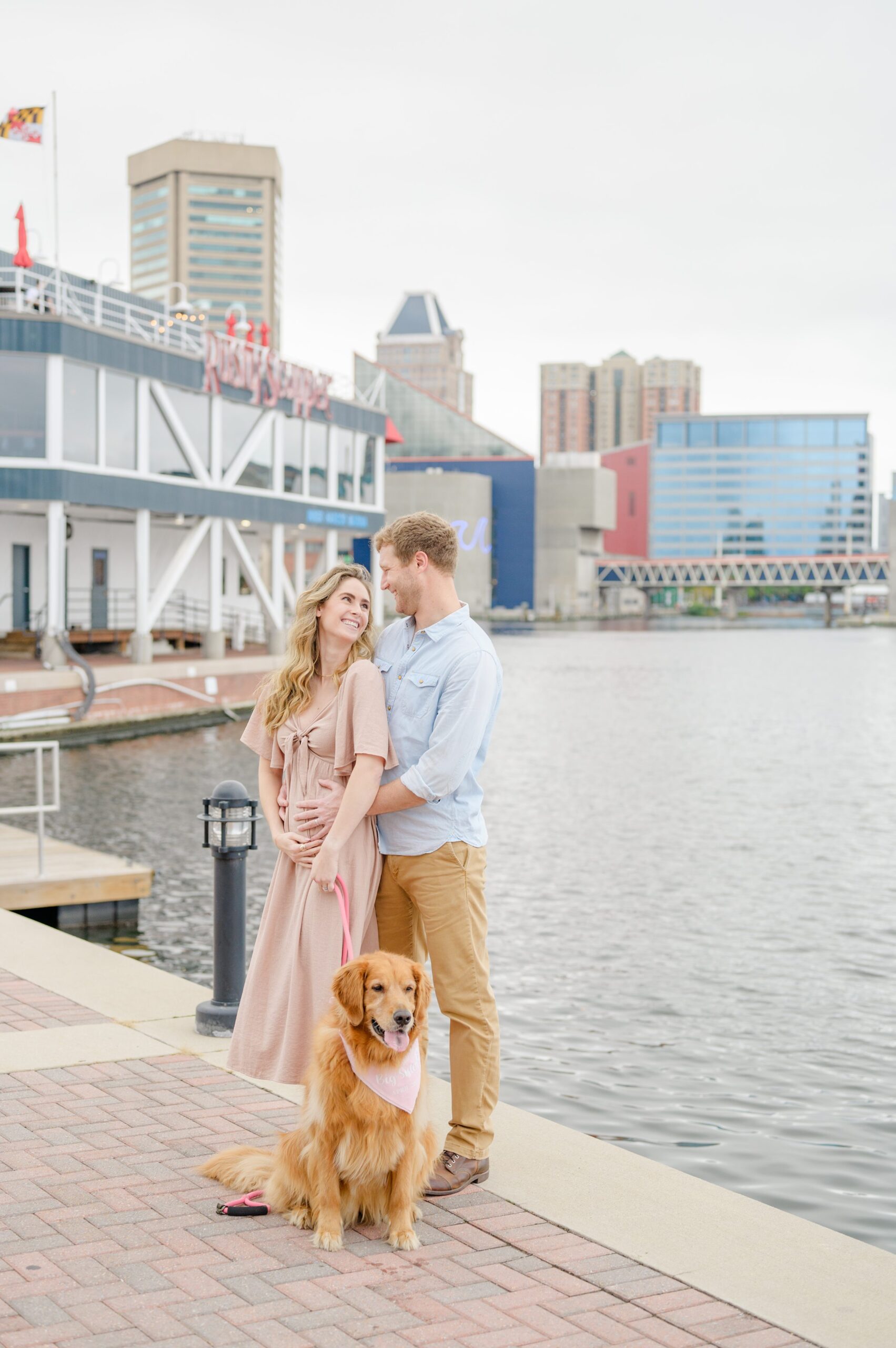 Pregnancy announcement photos at the Baltimore Inner Harbor photographed by Baltimore Maternity Photographer Cait Kramer.