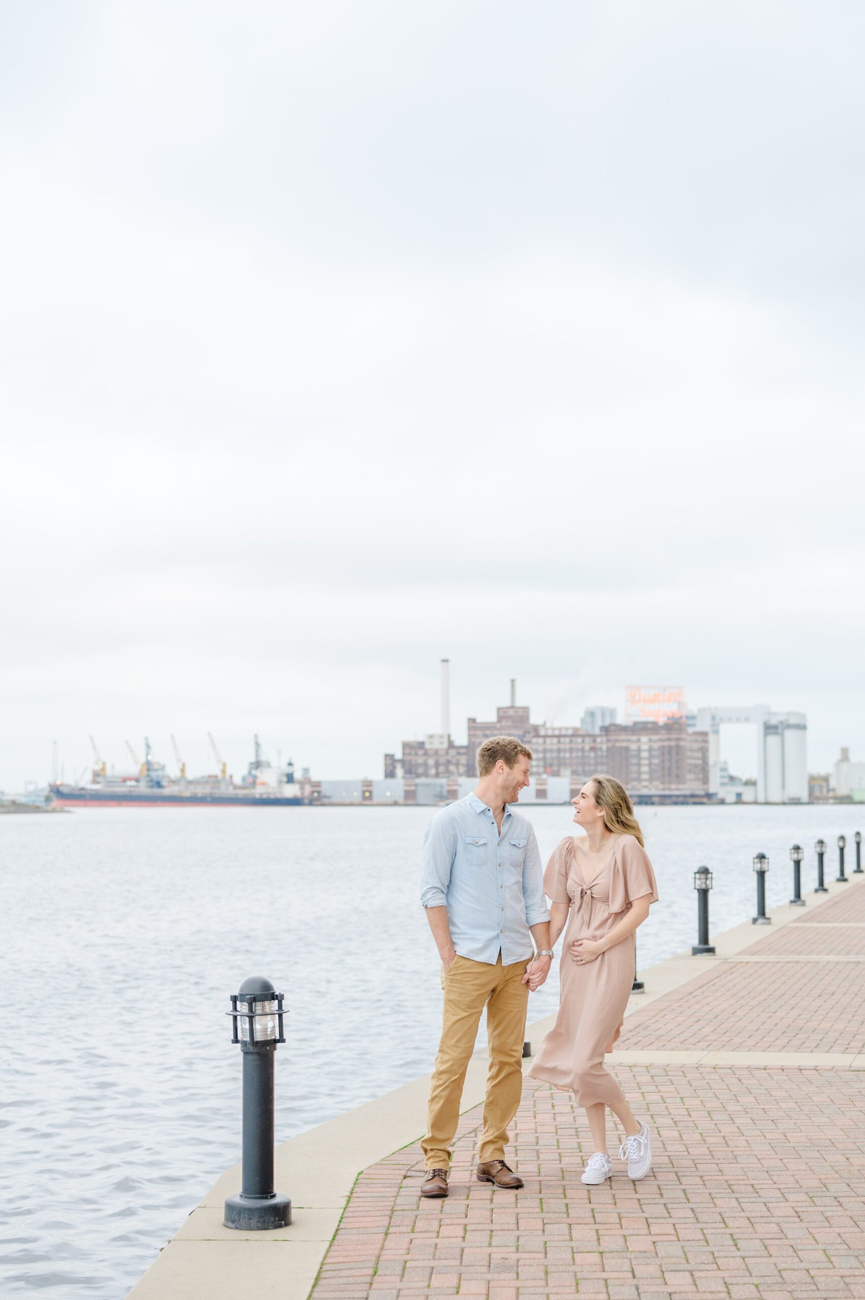 Pregnancy announcement photos at the Baltimore Inner Harbor photographed by Baltimore Maternity Photographer Cait Kramer.