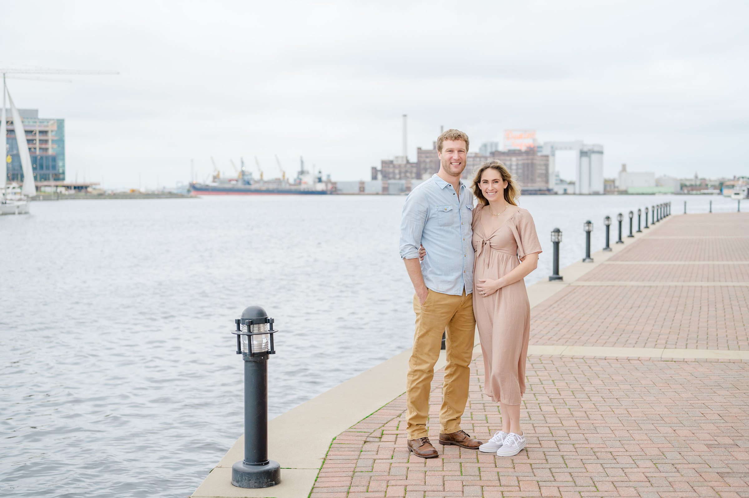 Pregnancy announcement photos at the Baltimore Inner Harbor photographed by Baltimore Maternity Photographer Cait Kramer.