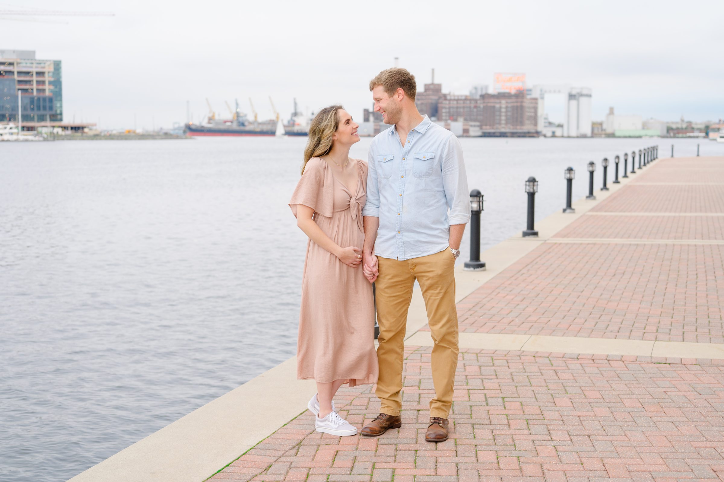 Pregnancy announcement photos at the Baltimore Inner Harbor photographed by Baltimore Maternity Photographer Cait Kramer.