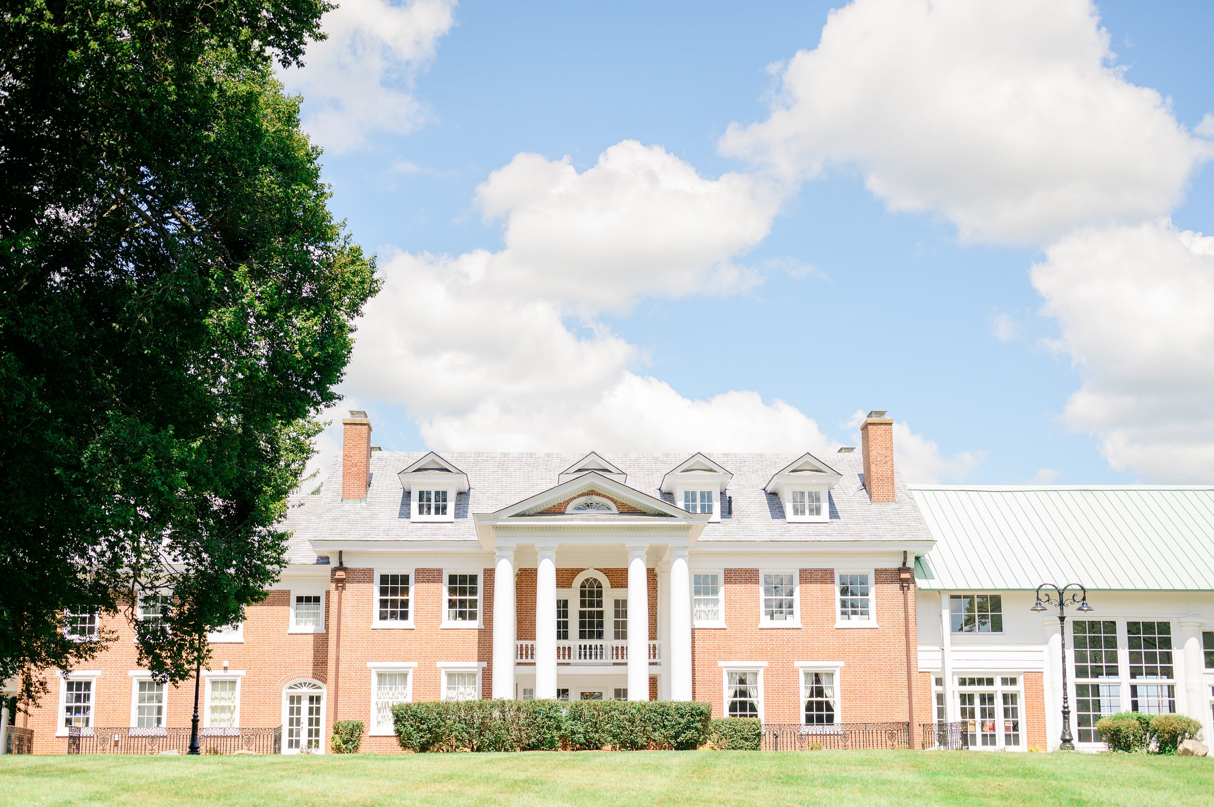Summer wedding day at Raspberry Plain Manor in Leesburg, Virginia. Photographed by Baltimore Wedding Photographer Cait Kramer.