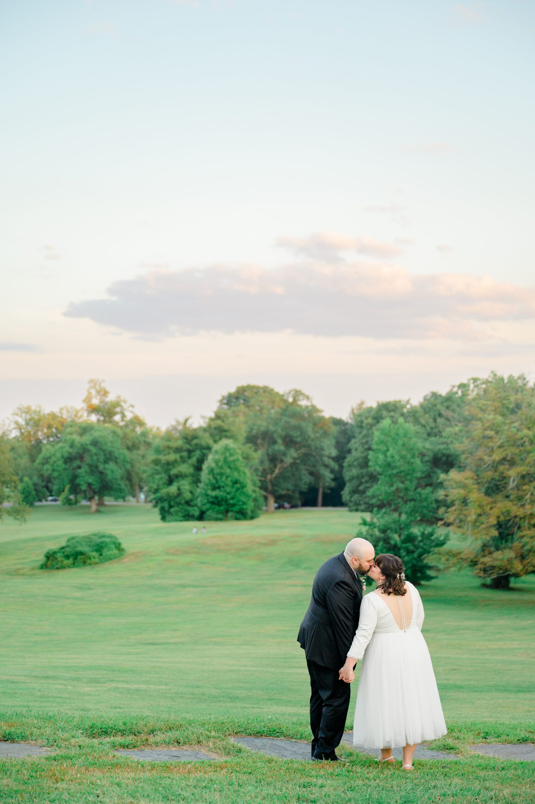 Golden hour newlywed portraits at the Maryland Zoo photographed by Baltimore Wedding Photographer Cait Kramer.