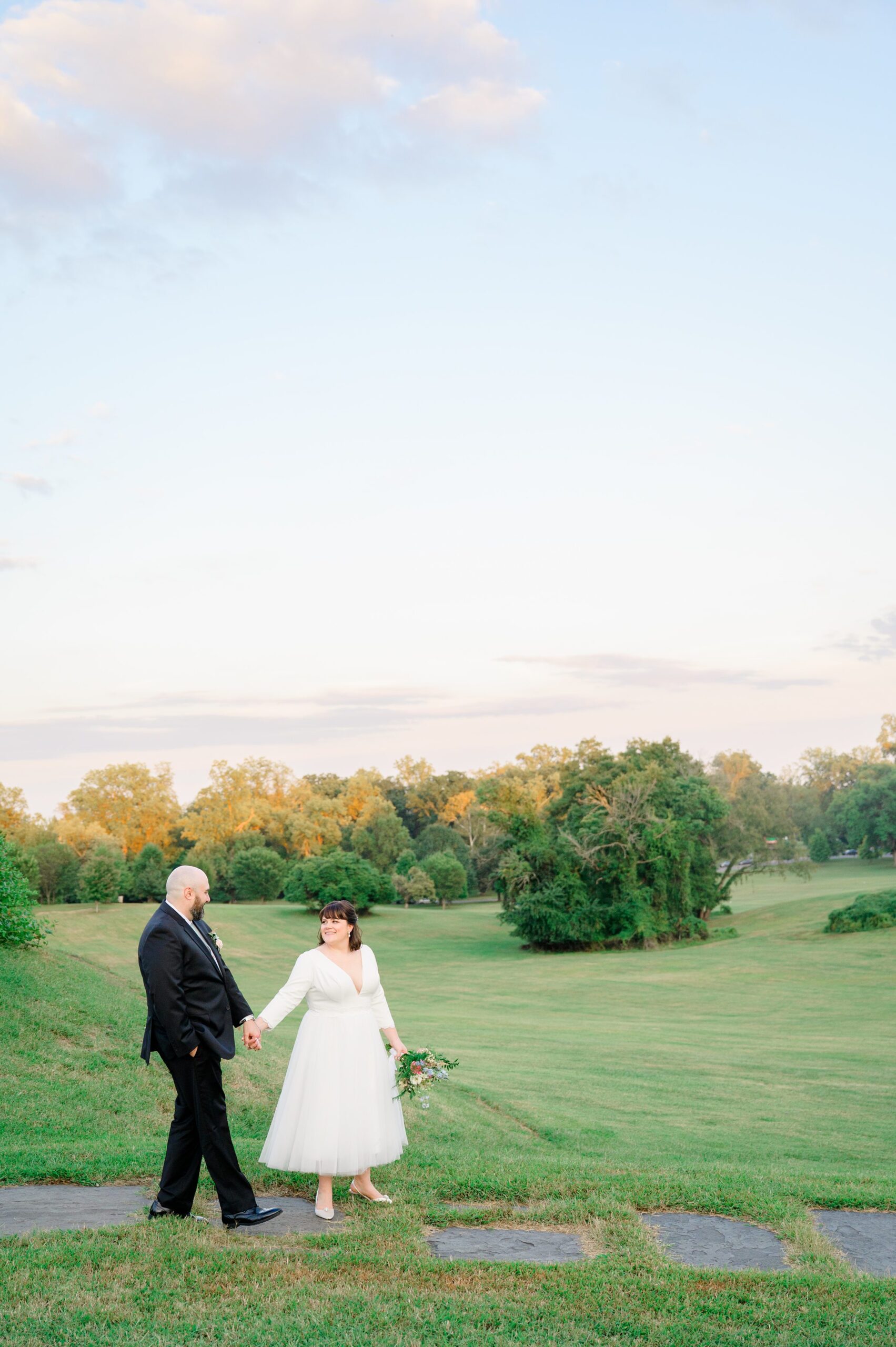 Golden hour newlywed portraits at the Maryland Zoo photographed by Baltimore Wedding Photographer Cait Kramer.