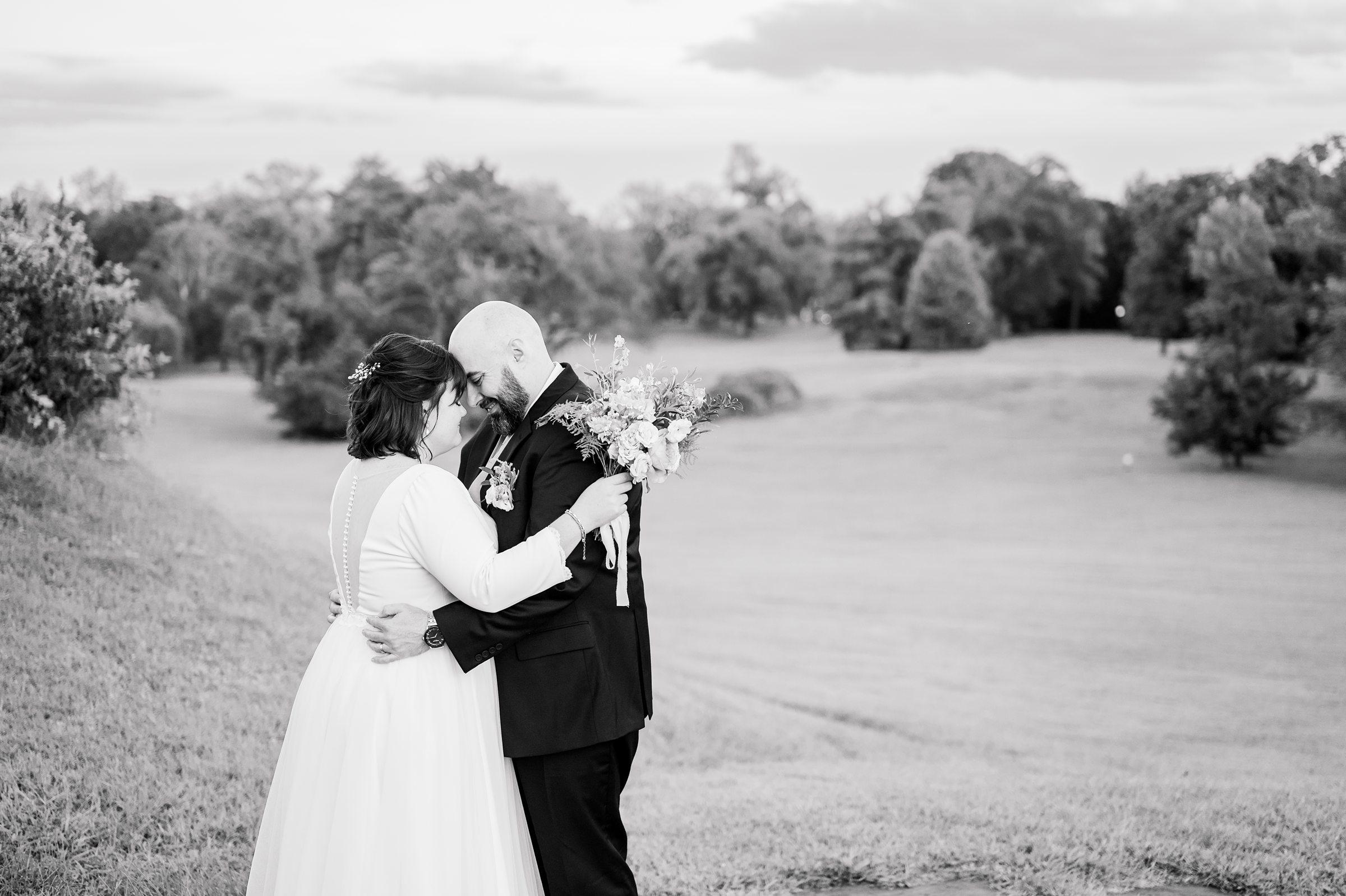 Golden hour newlywed portraits at the Maryland Zoo photographed by Baltimore Wedding Photographer Cait Kramer.