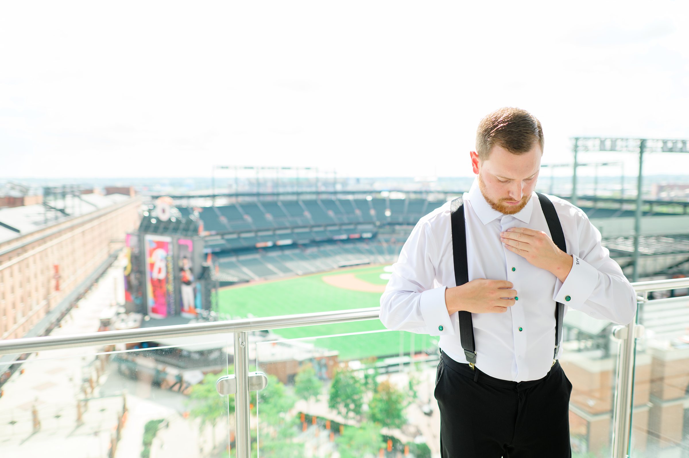 Groom getting ready at Oriole Park at Camden Yards Wedding photographed by Baltimore Wedding Photographer Cait Kramer.