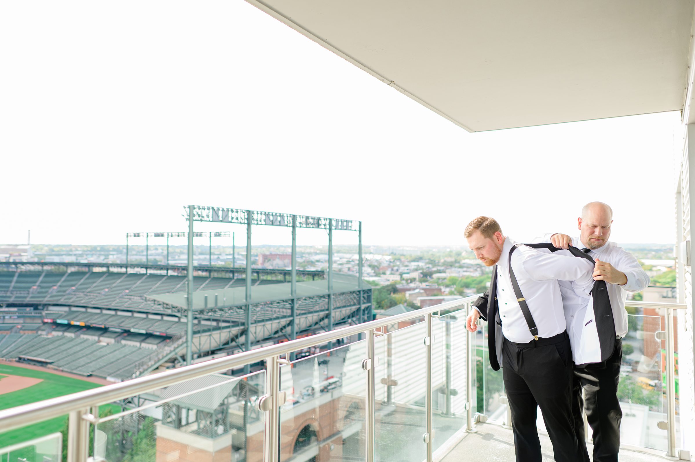 Groom getting ready at Oriole Park at Camden Yards Wedding photographed by Baltimore Wedding Photographer Cait Kramer.