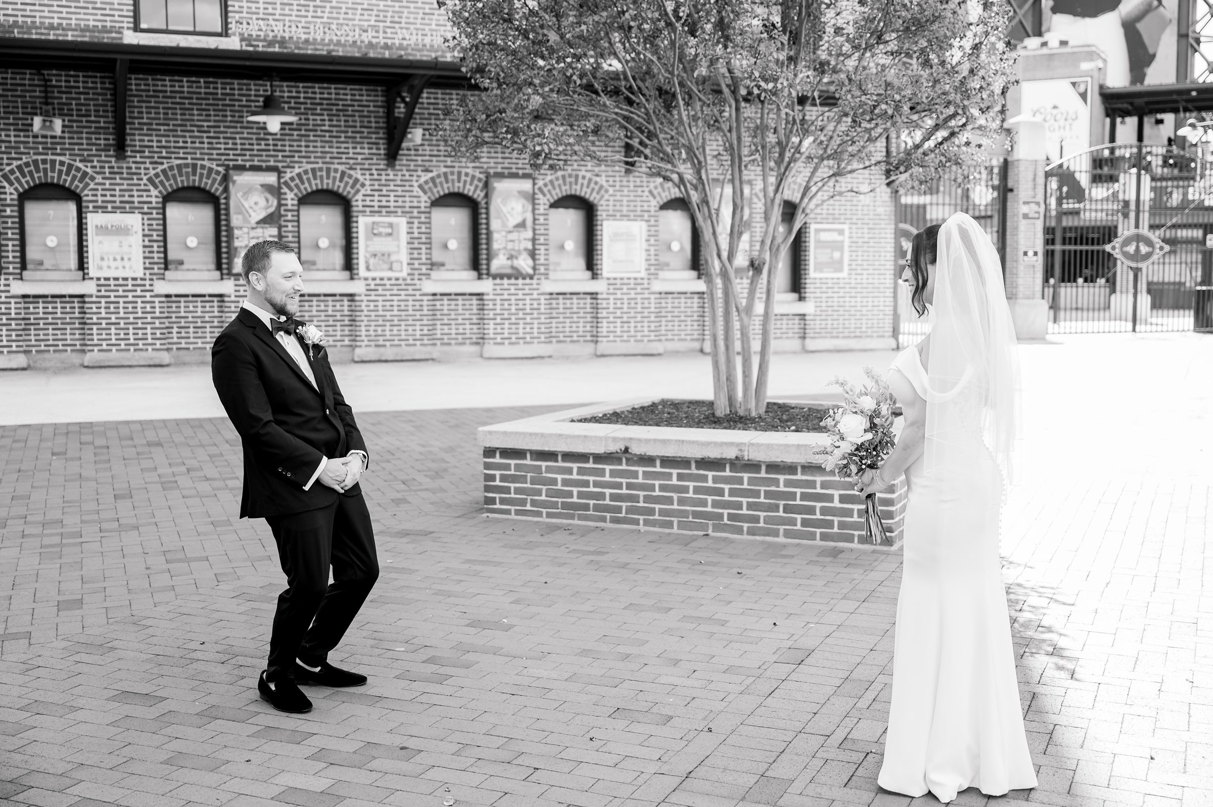 Bride and Groom first look at Oriole Park at Camden Yards Wedding photographed by Baltimore Wedding Photographer Cait Kramer.
