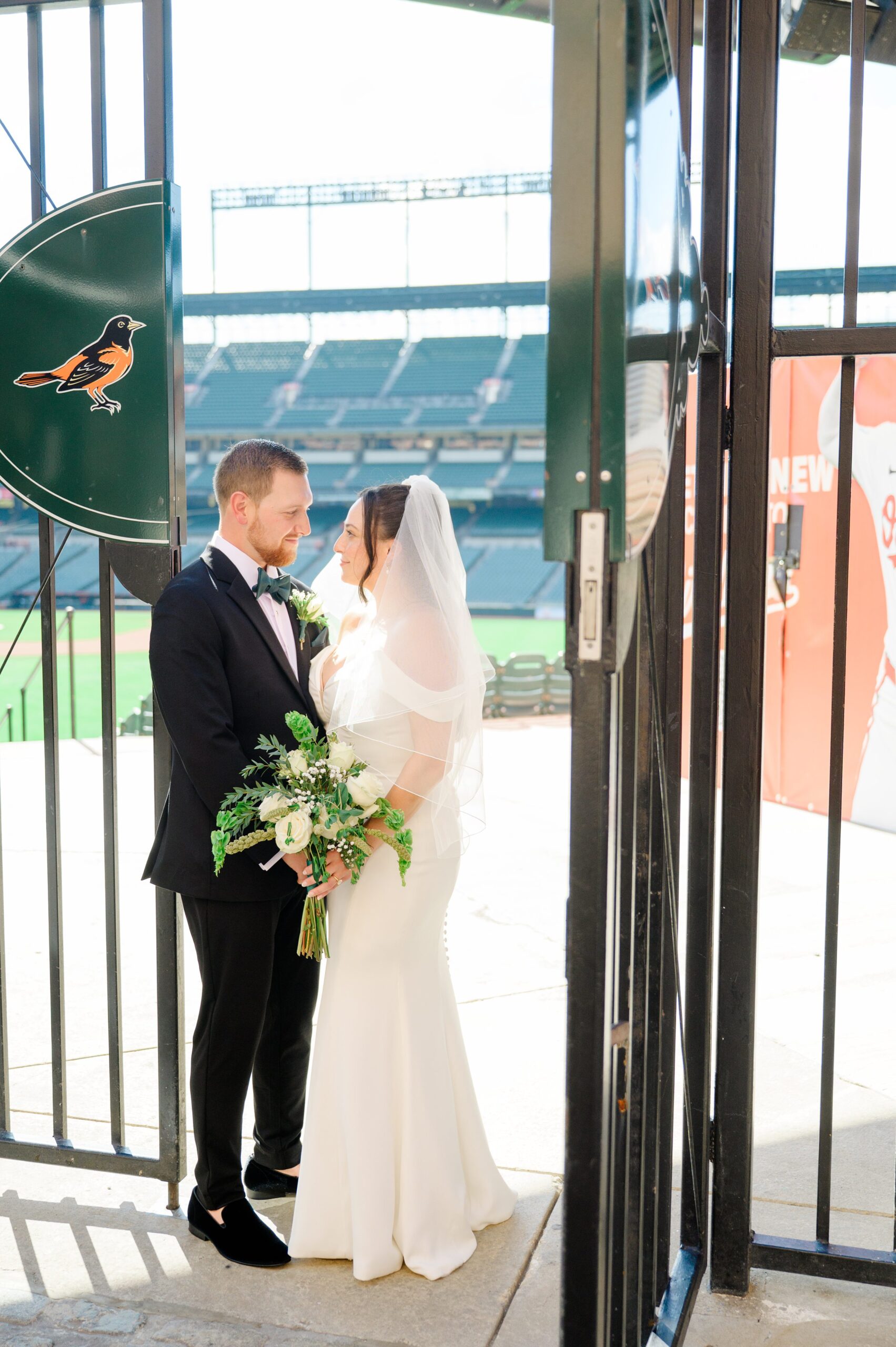 Bride and Groom portraits at Oriole Park at Camden Yards Wedding photographed by Baltimore Wedding Photographer Cait Kramer.