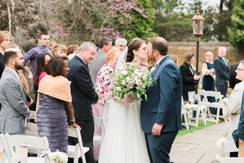  What I love most about this photo? These two sharing in a moment of pure happiness, right after their I-do's! But my favorite part? I love seeing their sweet family and friends enjoying this moment with them!  