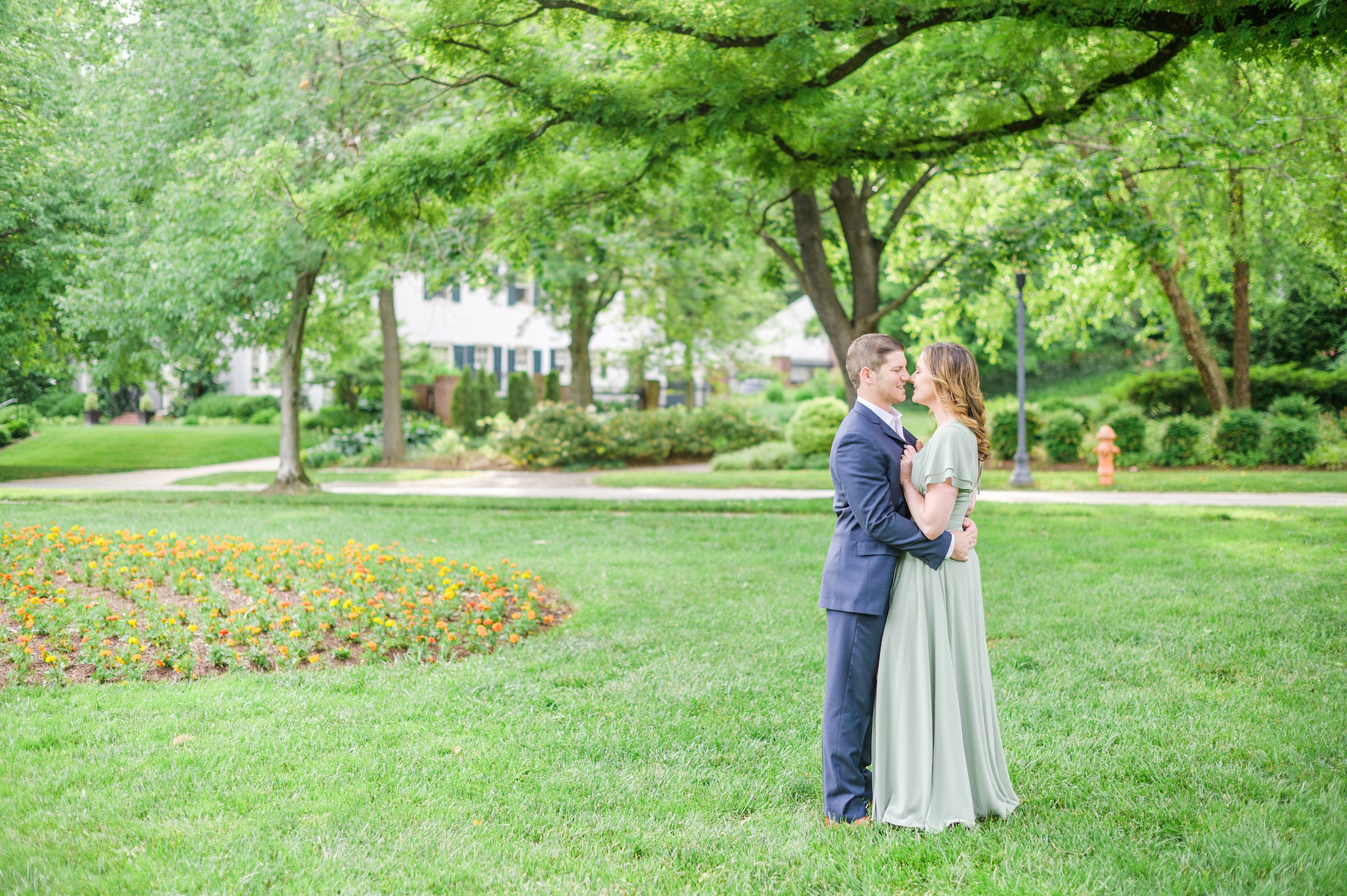 Engaged Couple smiles in Sherwood Gardens engagement session photographed by Maryland Wedding Photographer Cait Kramer Photography