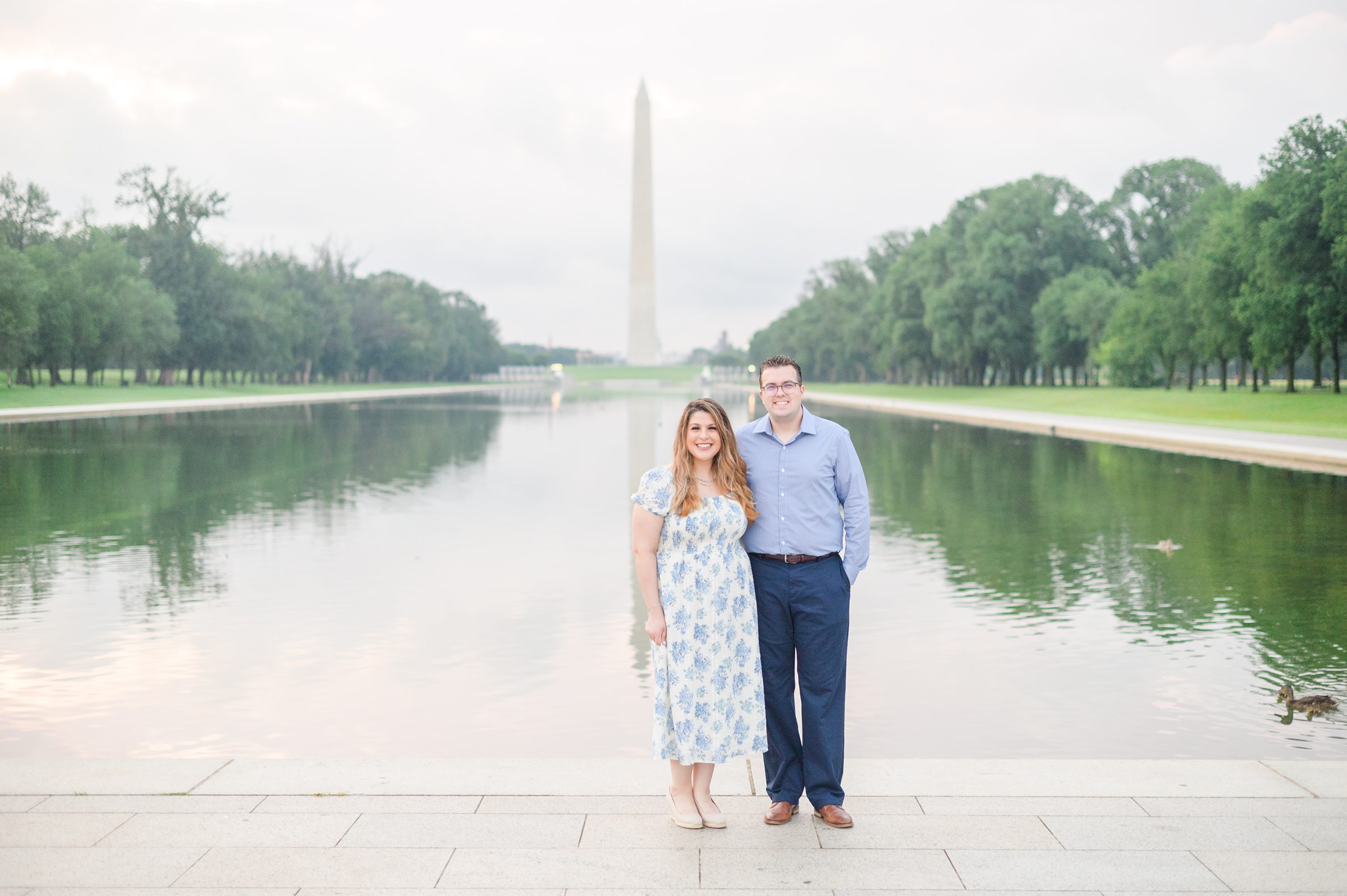 Couple smiles during their engagement photos at the Lincoln Memorial photographed by Baltimore Wedding Photographer, Cait Kramer Photography