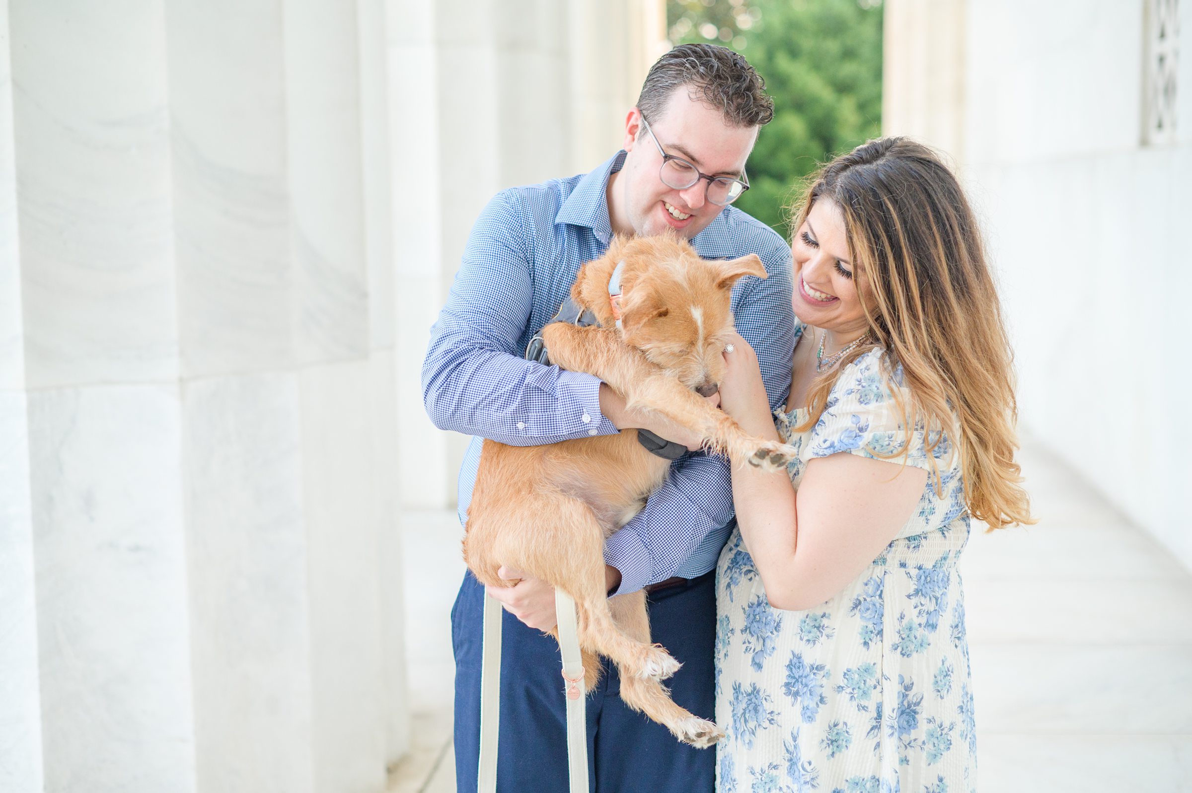 Couple smiles during their engagement photos at the Lincoln Memorial photographed by Baltimore Wedding Photographer, Cait Kramer Photography