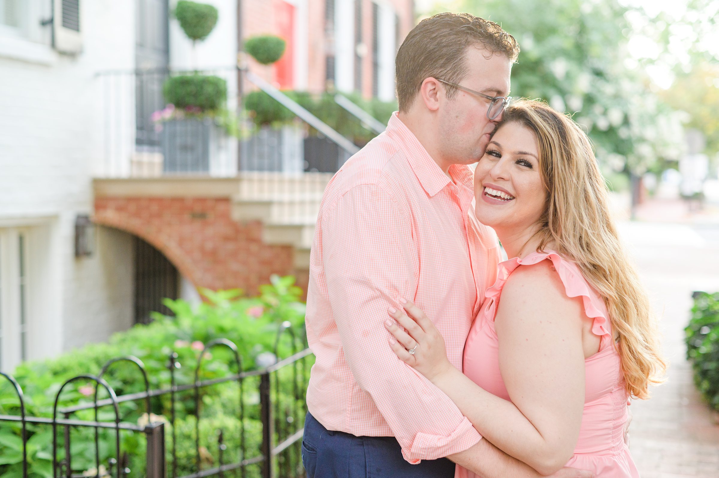 Engaged couple smiles in Georgetown, Washington, DC during engagement session photographed by Baltimore wedding photographer, Cait Kramer Photography