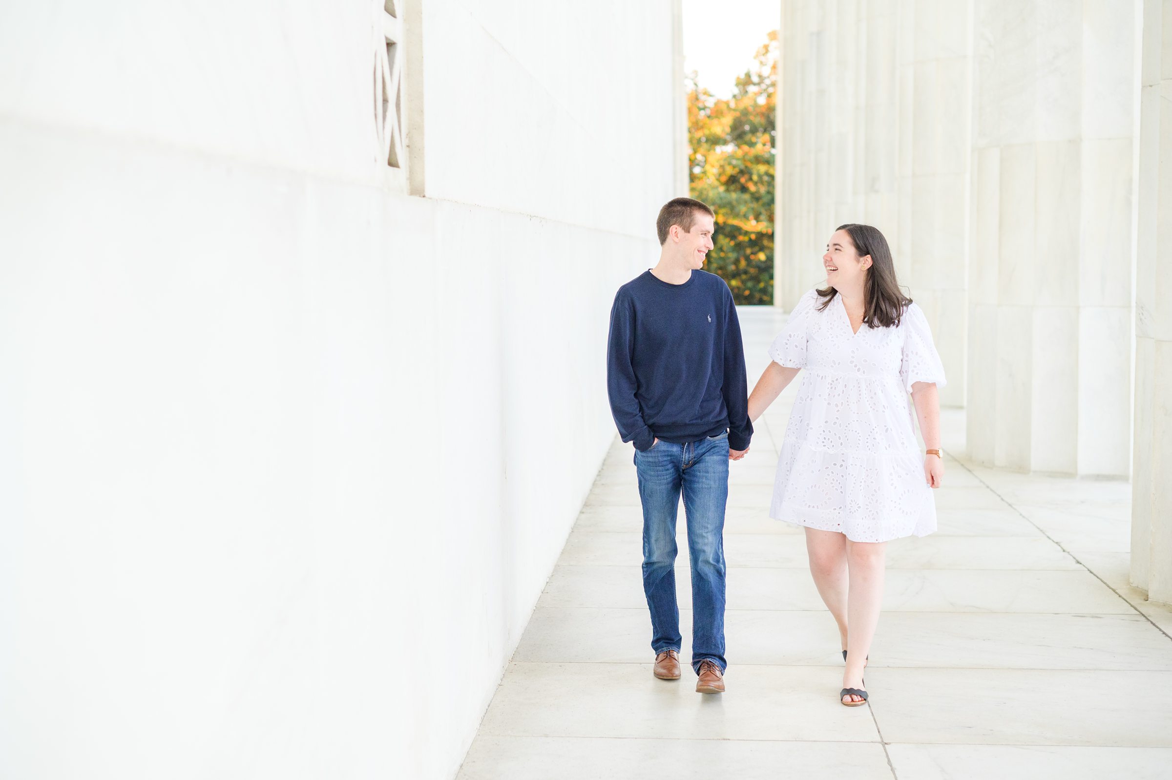 Couple smiles during their Lincoln Memorial engagement photos during session photographed by Baltimore wedding photographer, Cait Kramer