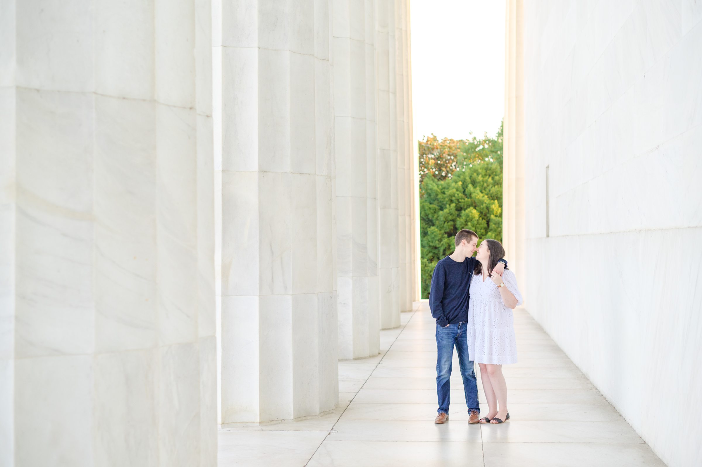 Couple smiles during their Lincoln Memorial engagement photos during session photographed by Baltimore wedding photographer, Cait Kramer