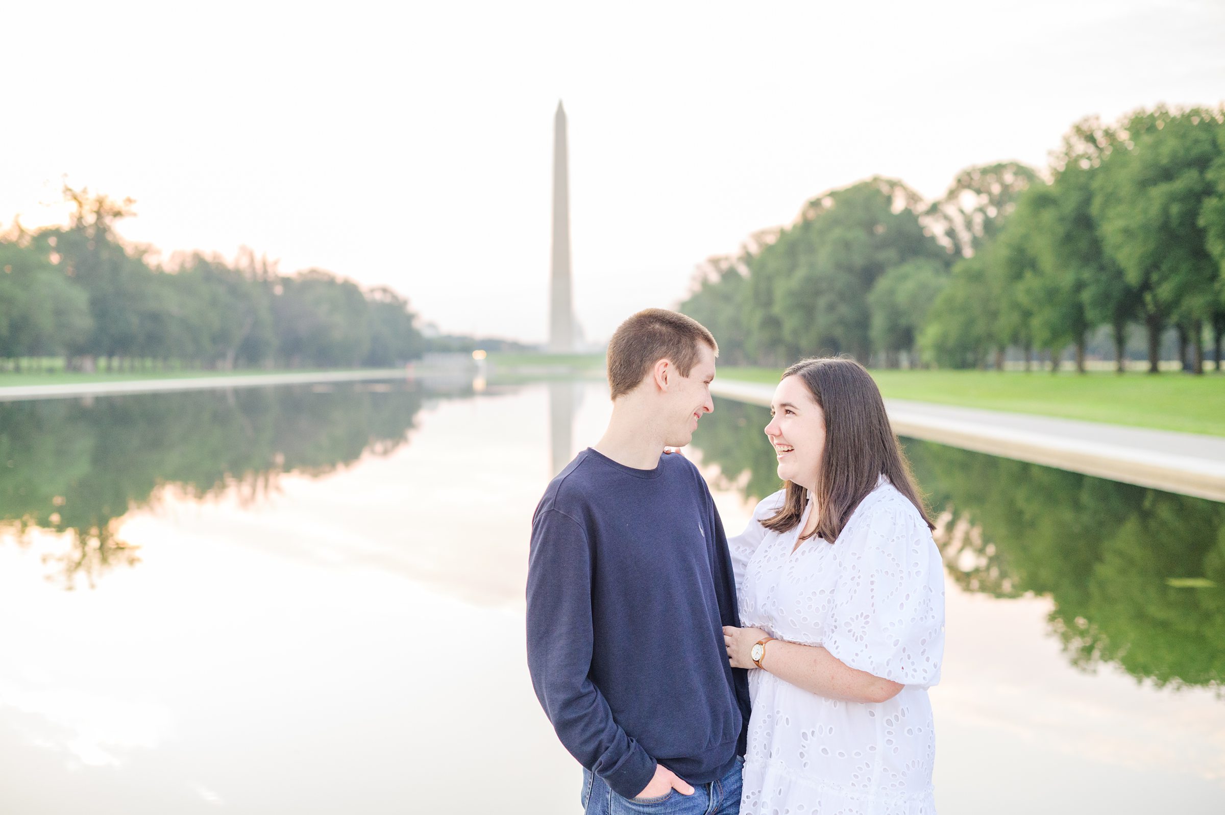 Couple smiles during their Lincoln Memorial engagement photos during session photographed by Baltimore wedding photographer, Cait Kramer