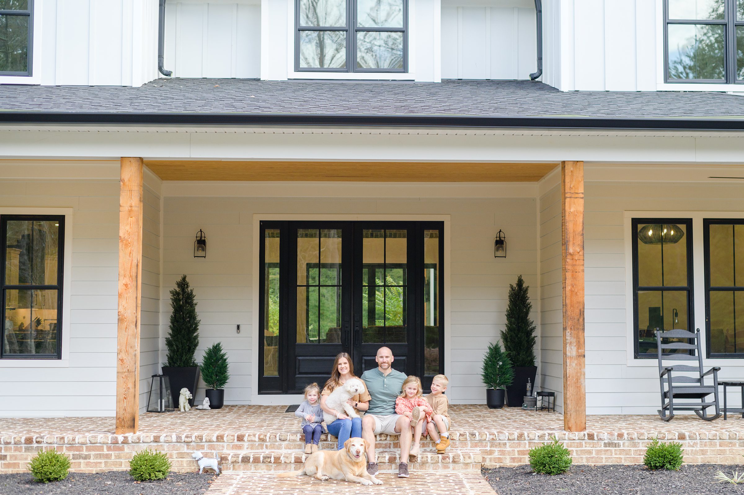 Stacey Caito, Chantilly Realtor, smiles with her family during her brand session photographed by Virginia brand photographer, Cait Kramer Photography