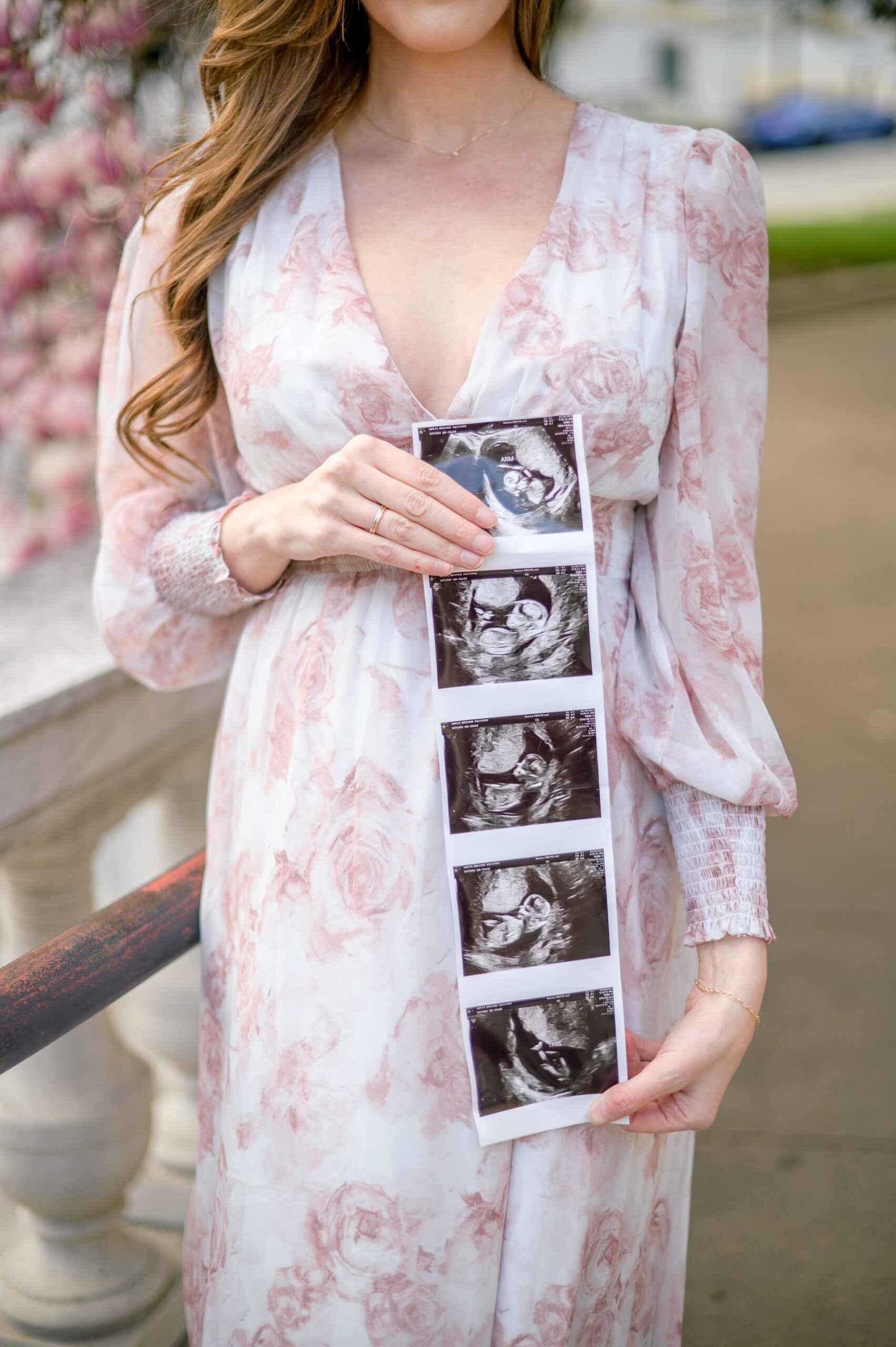 Meg and Sean's maternity photos in Baltimore featuring stunning pink magnolia trees by Baltimore Photographer Cait Kramer Photography