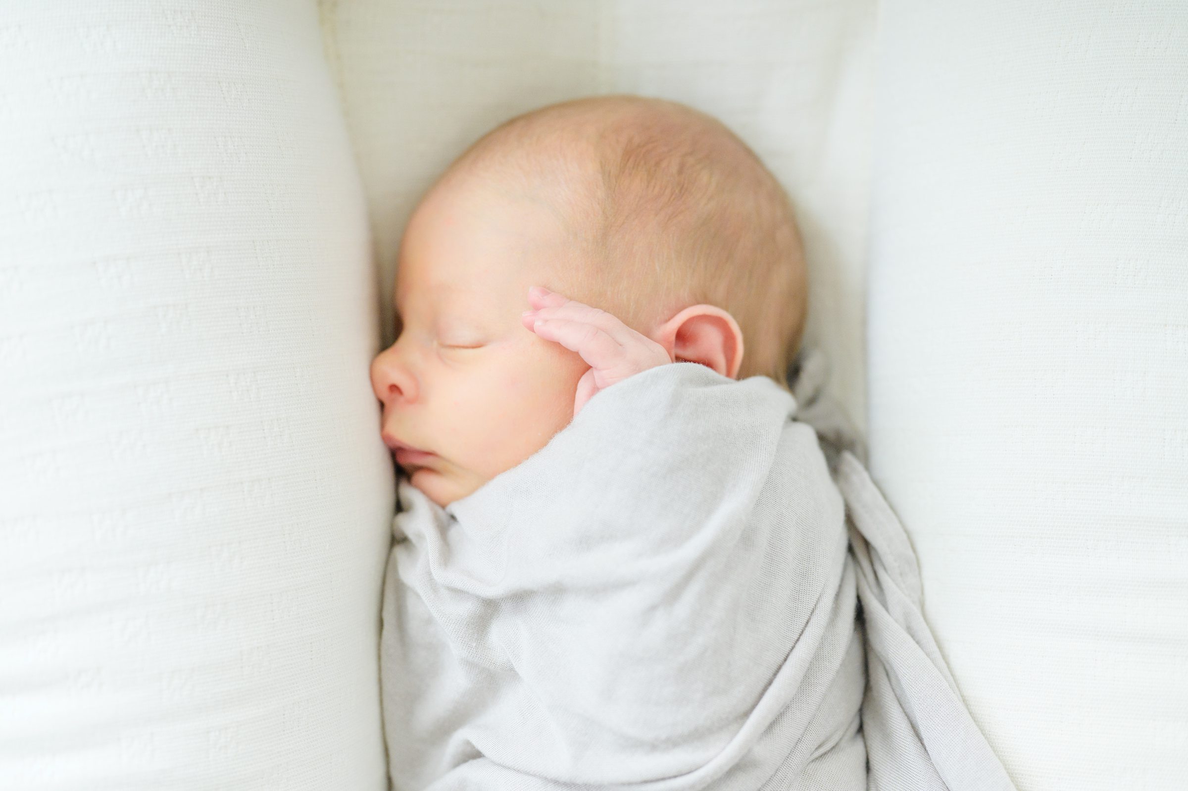 In-home newborn and family portrait session in Washington, D.C. photographed by Lifestyle Newborn Photographer Cait Kramer Photography.