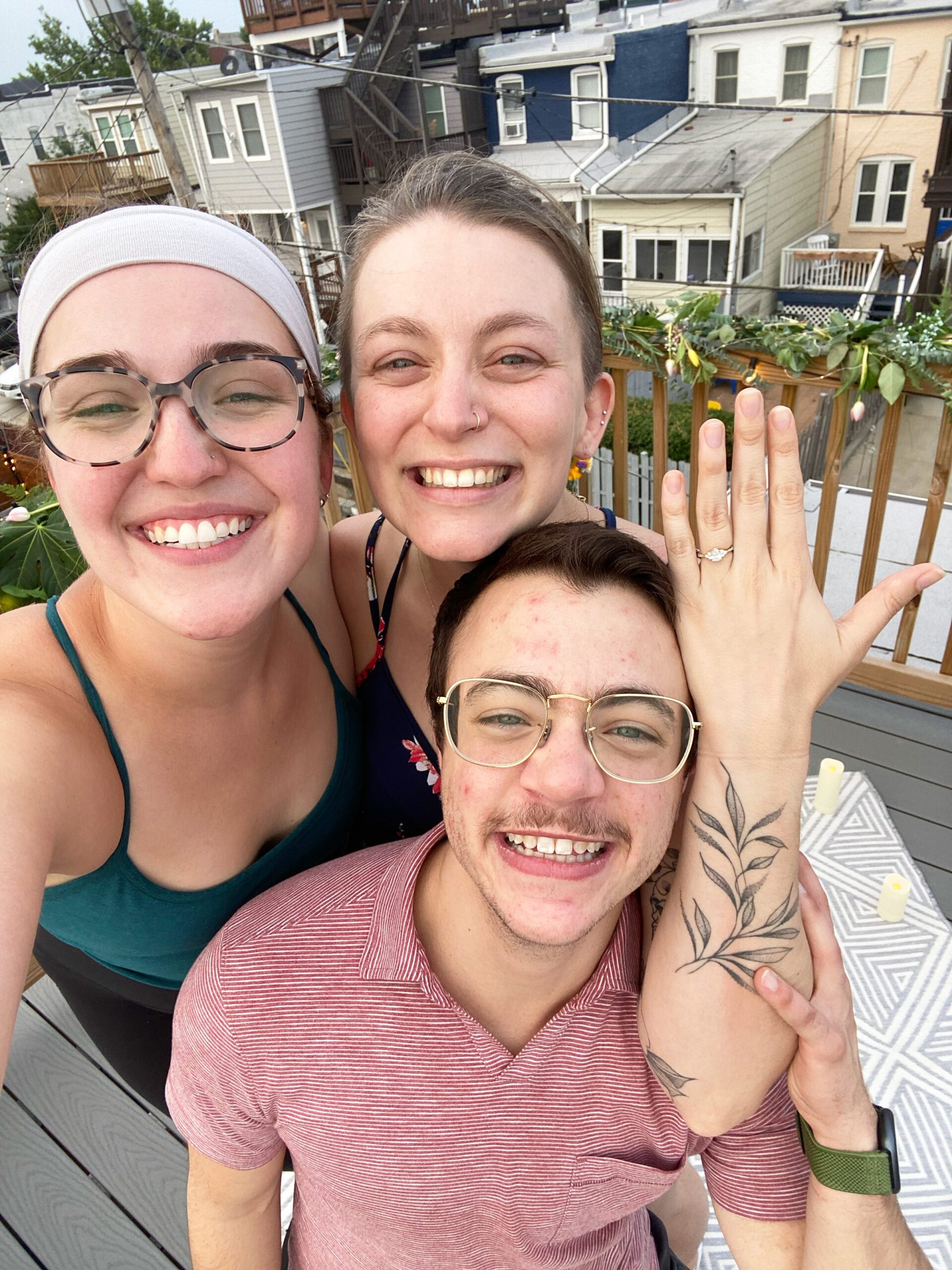 Sarah and Brenton's surprise proposal at their apartment rooftop in Baltimore, Maryland photographed by Baltimore Wedding Photographer Cait Kramer.